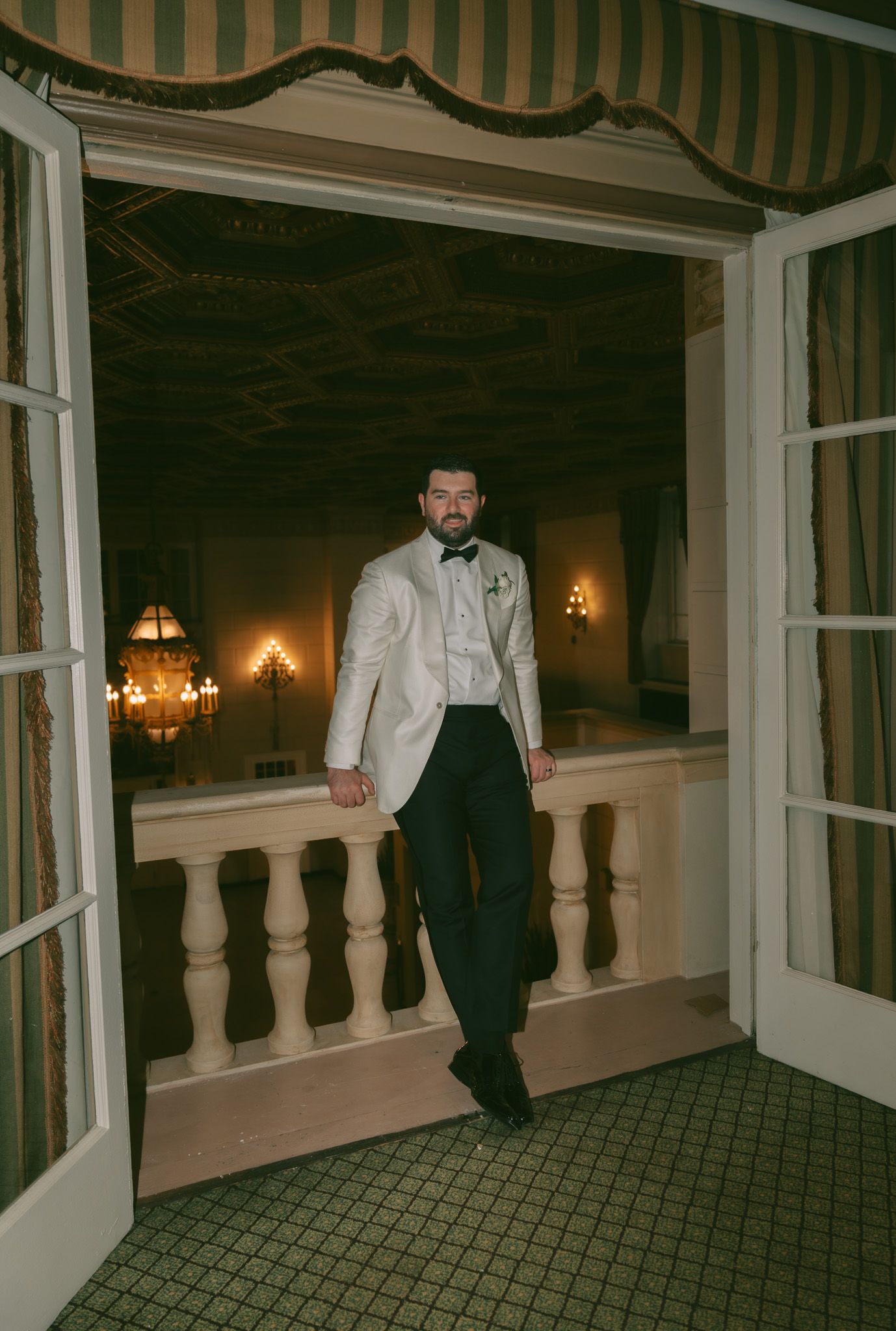 Elegant formal wear against classic interior with balustrade and warm lighting in downtown pittsburgh, pa.