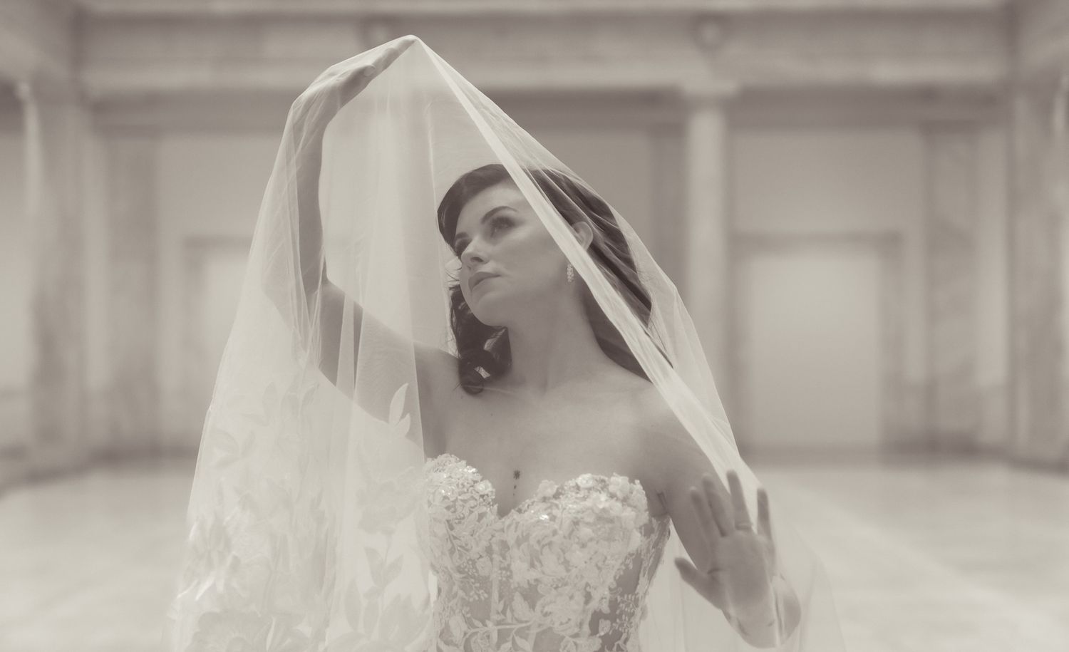 Elegant bridal portrait series in soft sepia tones showcasing delicate lace and veil details.