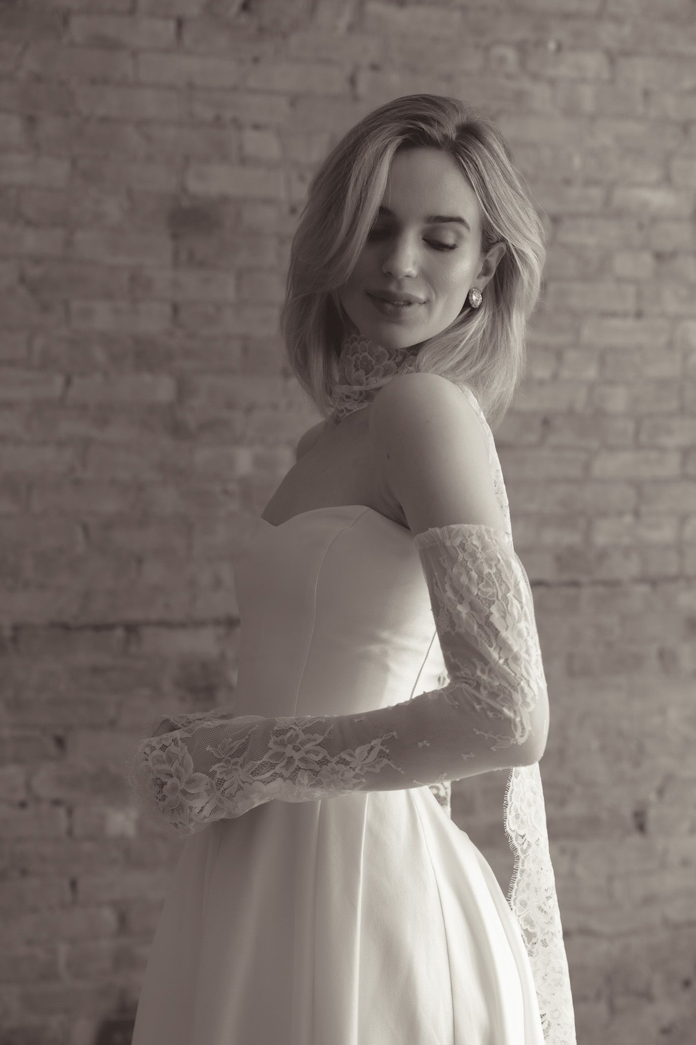 Classic black and white portrait featuring lace details and an elegant bridal gown.