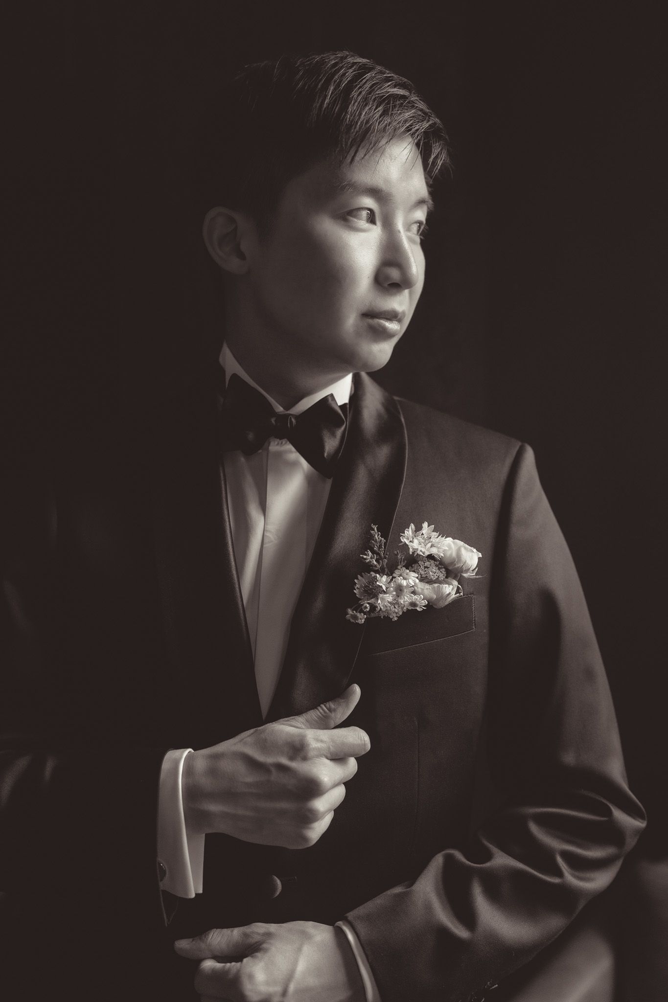 Classic black and white portrait of a groom in formal attire with boutonniere in Pittsburgh PA.