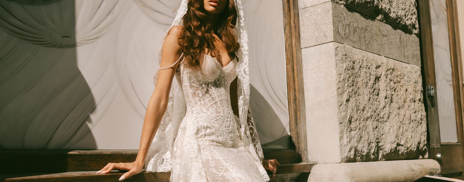 Fitted white Galia Lahav wedding dress with intricate lace detailing captured in the streets of Soho, NYC