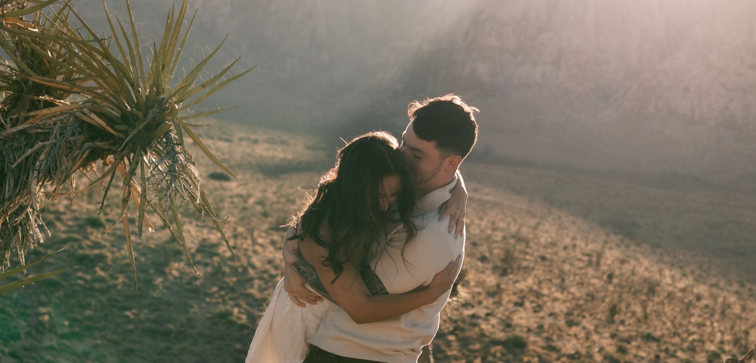 Couple enjoying a romantic moment in the desert sunset in red rock canyon, las vegas, nv
