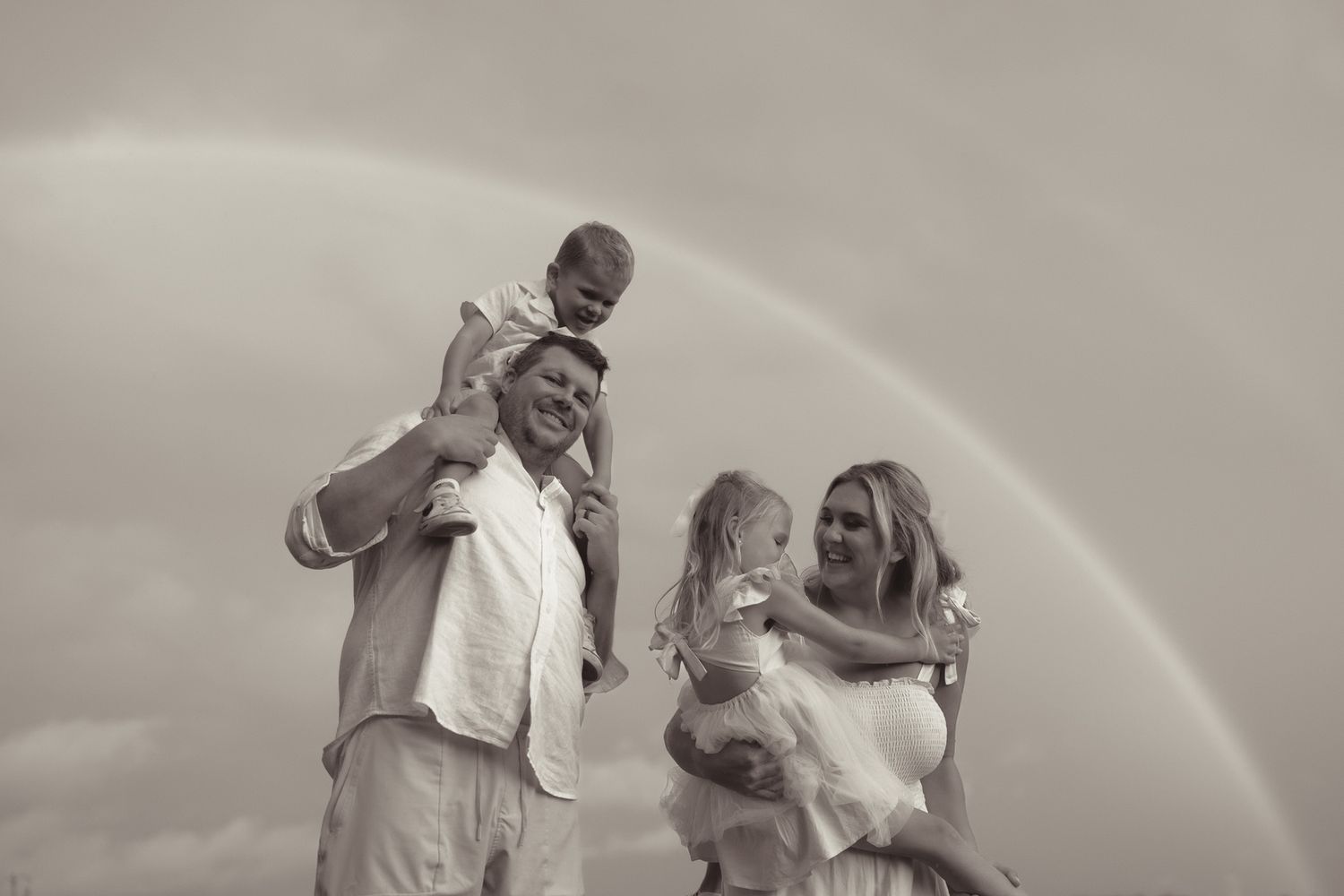 Black and white series of joyful wedding celebration moments outdoors.