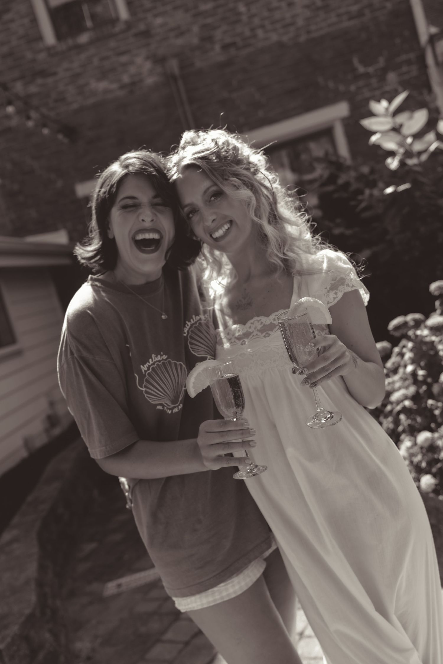 Candid black and white photos capturing joyful laughter and celebration at a wedding.