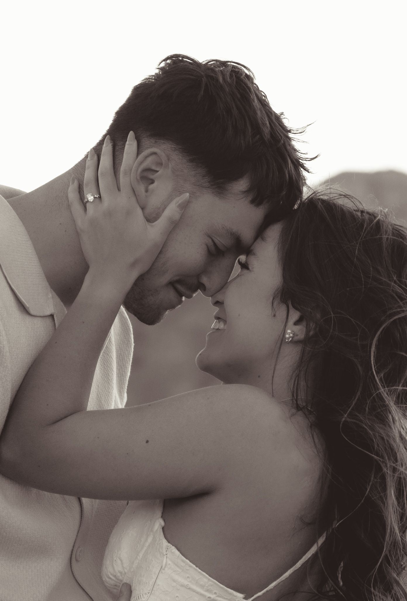 Romantic engagement sepia-toned portrait of couple embracing outdoors in las vgeas NV