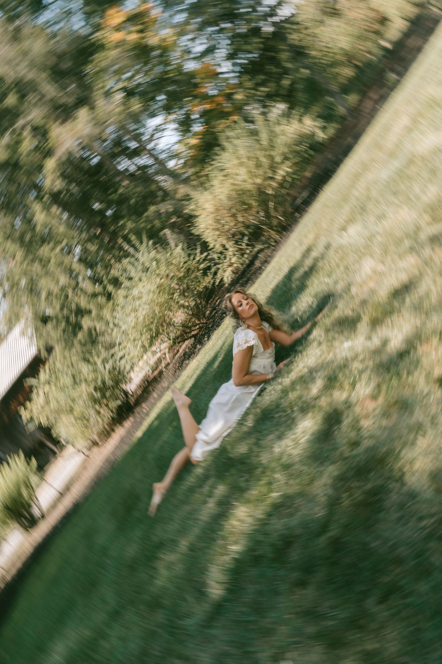 Abstract blurred motion photography of people in a grassy outdoor setting.