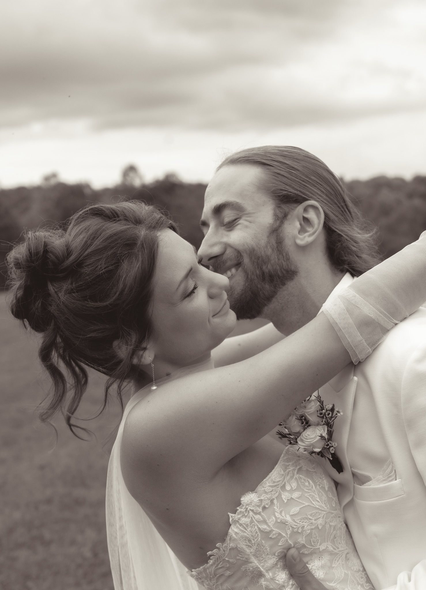 A series of five romantic black and white photos showing a couple sharing intimate moments in formal attire.