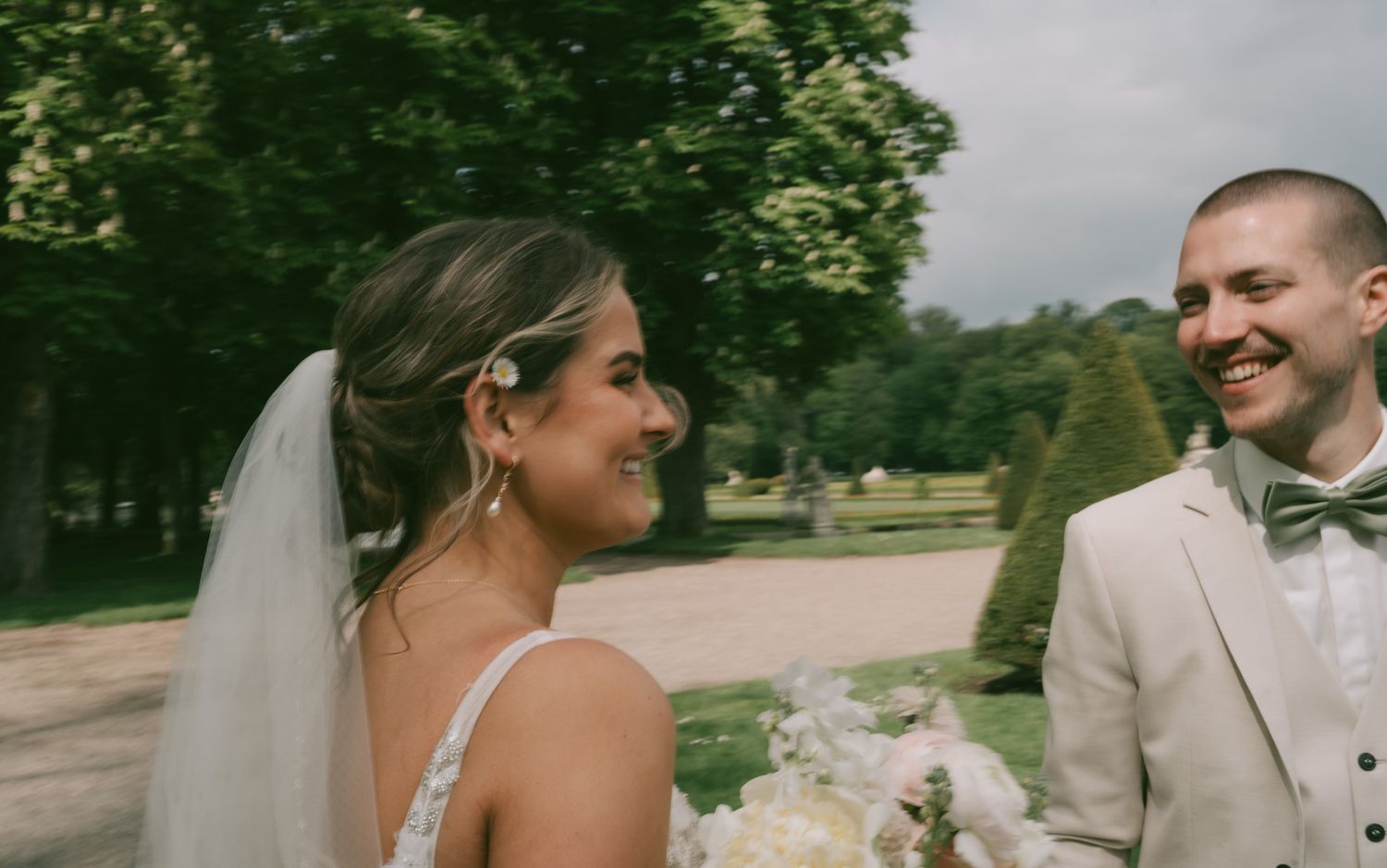 Wedding couple sharing a joyful moment outdoors on their special day in Germany.