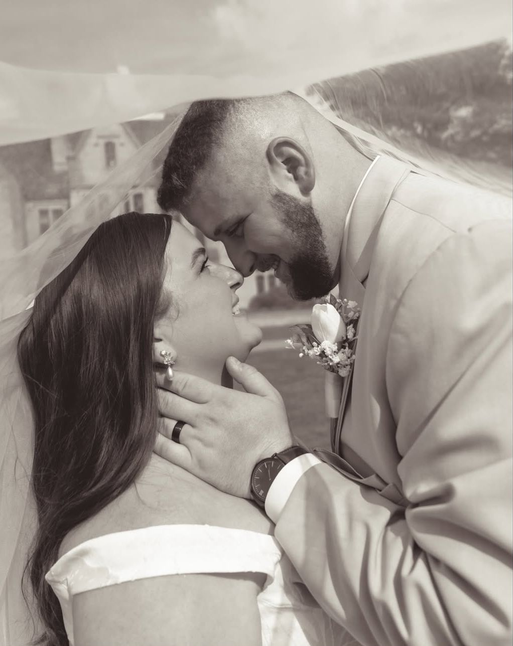 A romantic black and white photo series showing a couple sharing tender kisses in multiple close-up shots.