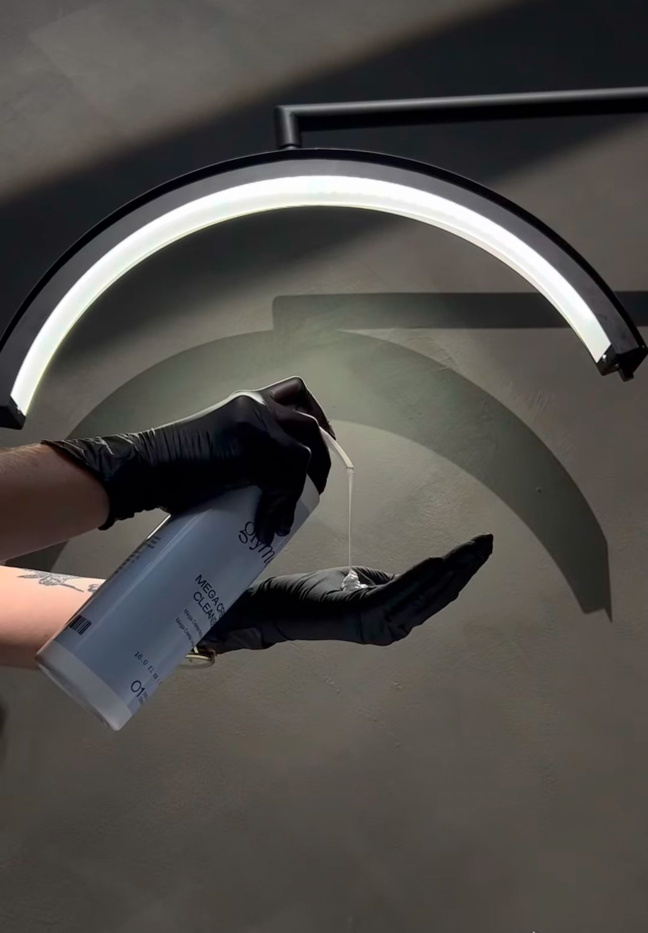Black and white architectural detail showing curved ceiling arches in dramatic lighting.