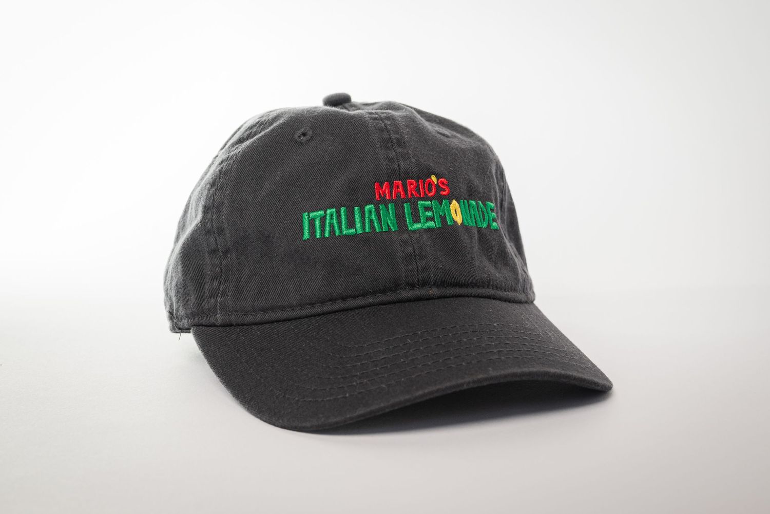 Black baseball cap with Mario's Italian Lemonade text in red and green.