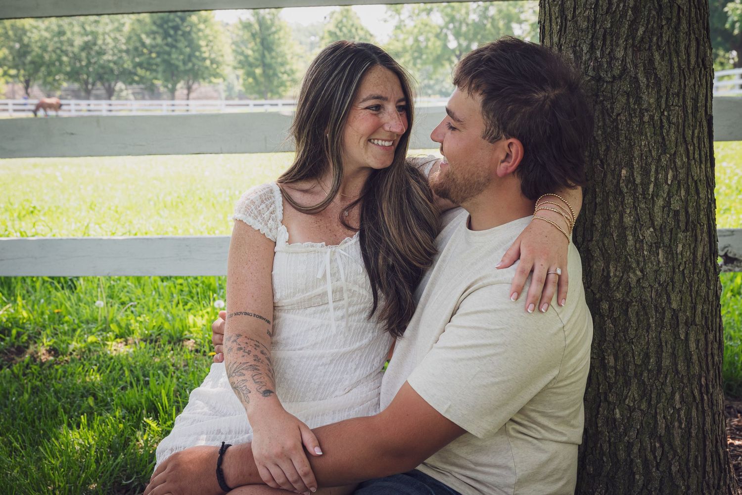 Couple sitting together under a tree in a park on a sunny day. goose.img photography LLC - Chicago Photographer