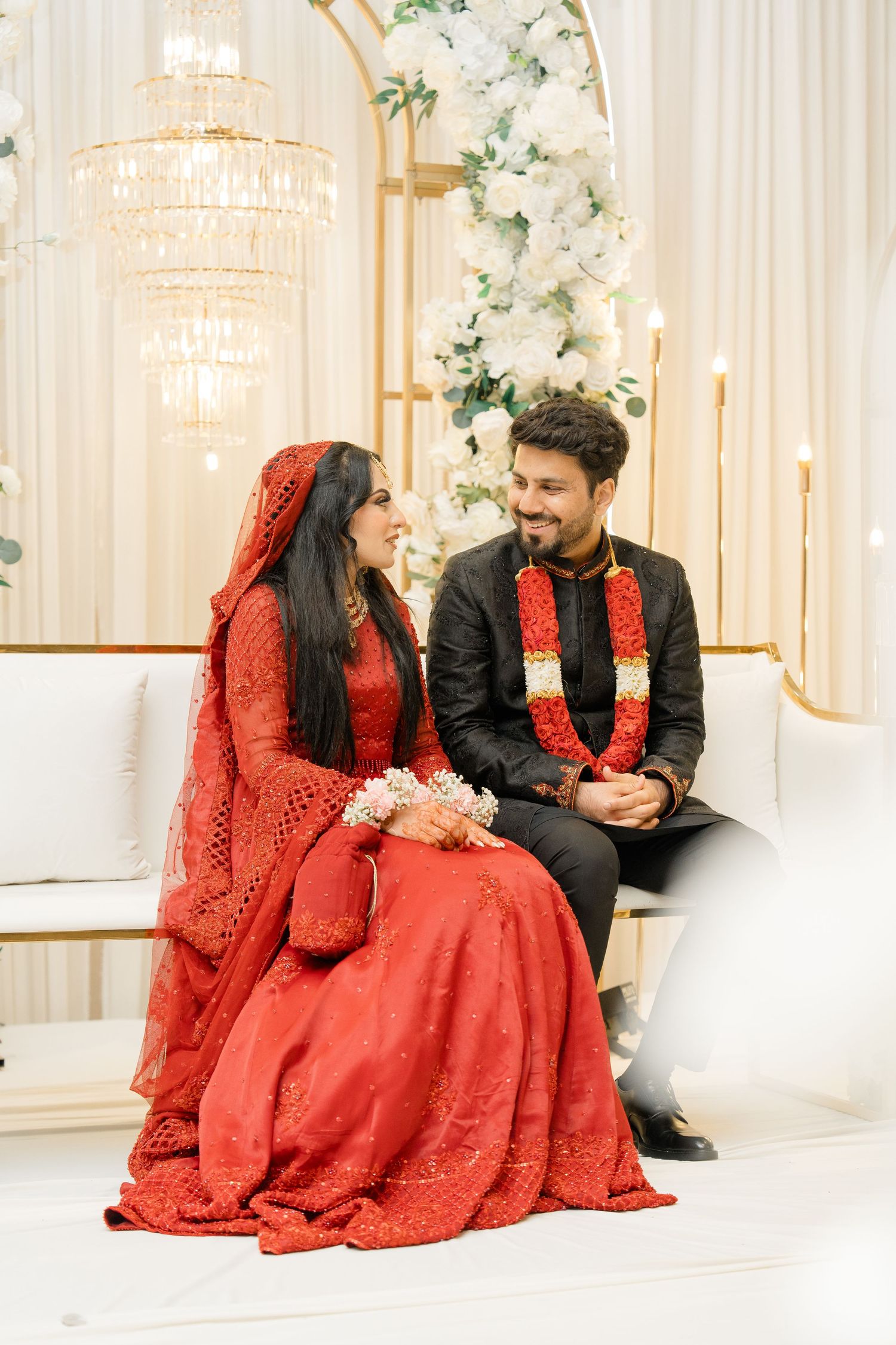 Toronto Pakistani Muslim wedding photographer captures a nikaah bride in a red lehenga & groom in black sherwani
