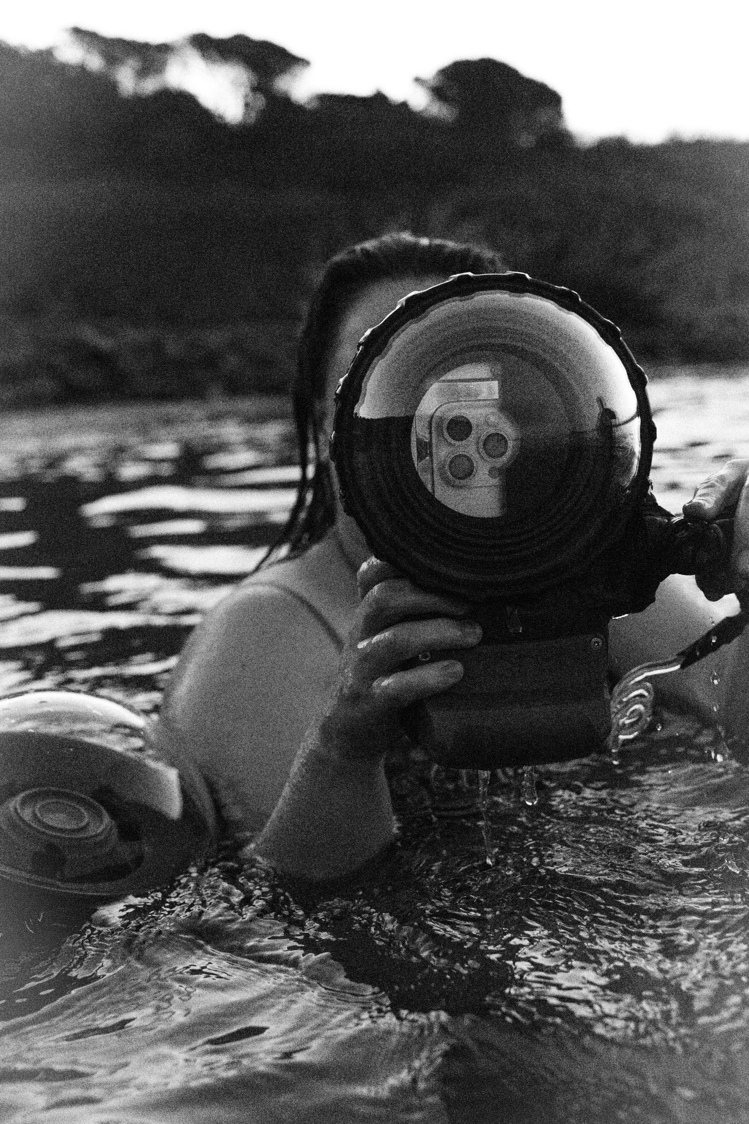Image of photographer Libby Tozer in ocean with her waterproof housing