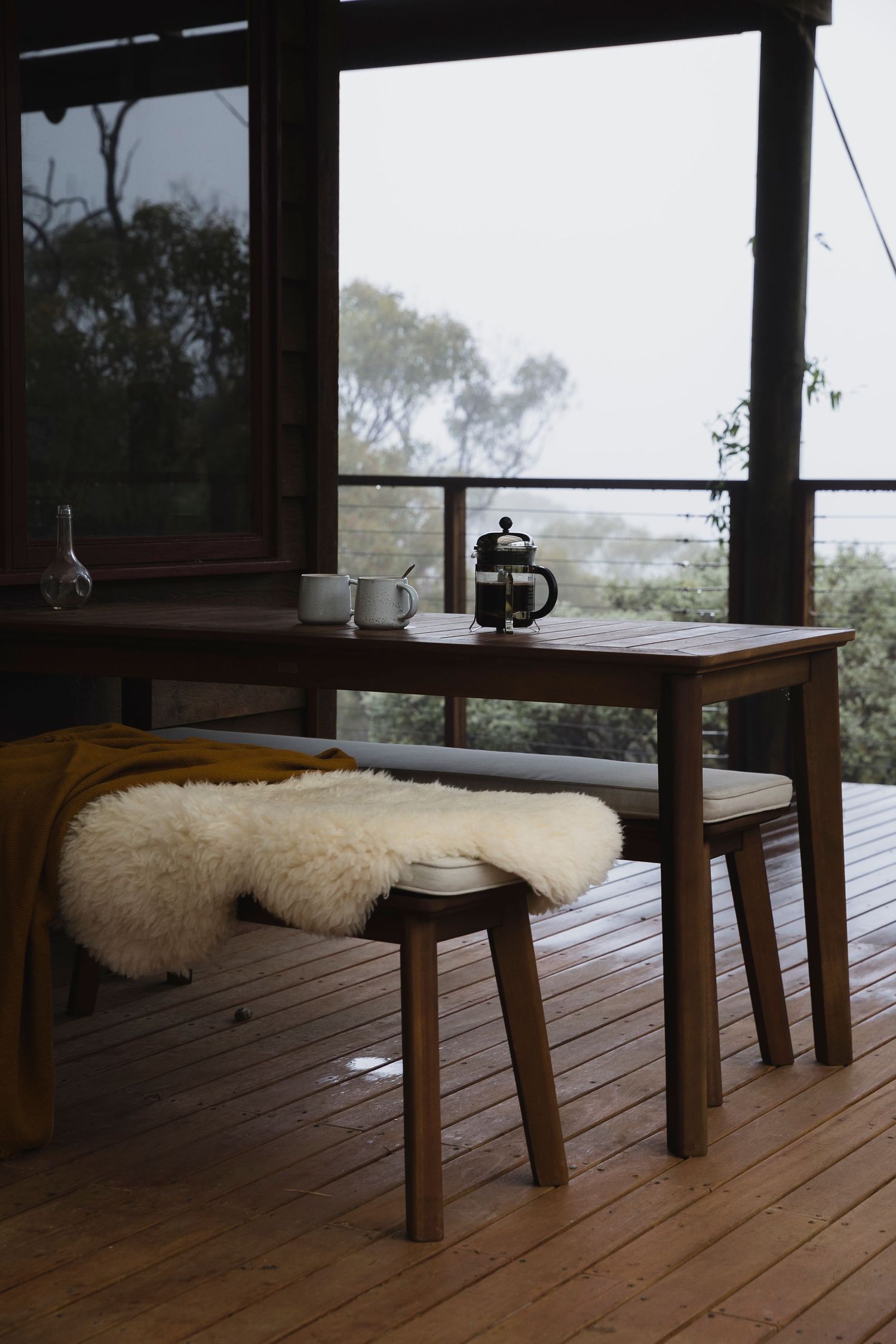 Table and chairs on porch in winter at Grasstree Gully near Deep Creek, Fleurieu Peninsula, South Australia