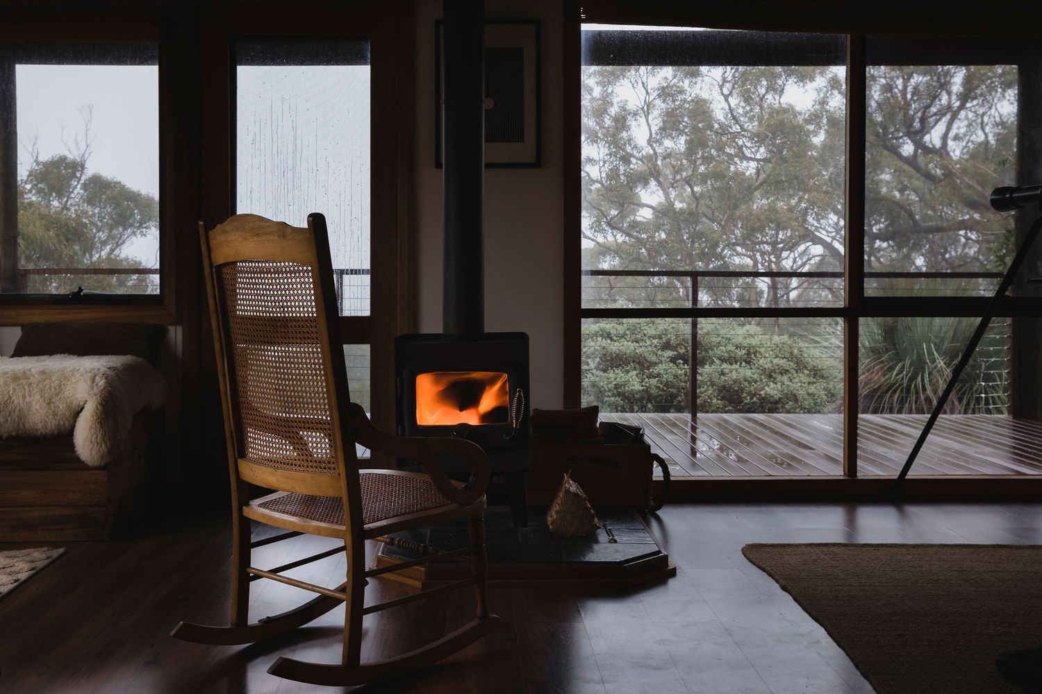 Chair and fireplace infant of view at Grasstree Gulley, airbnb, near Deep Creek, South Australia