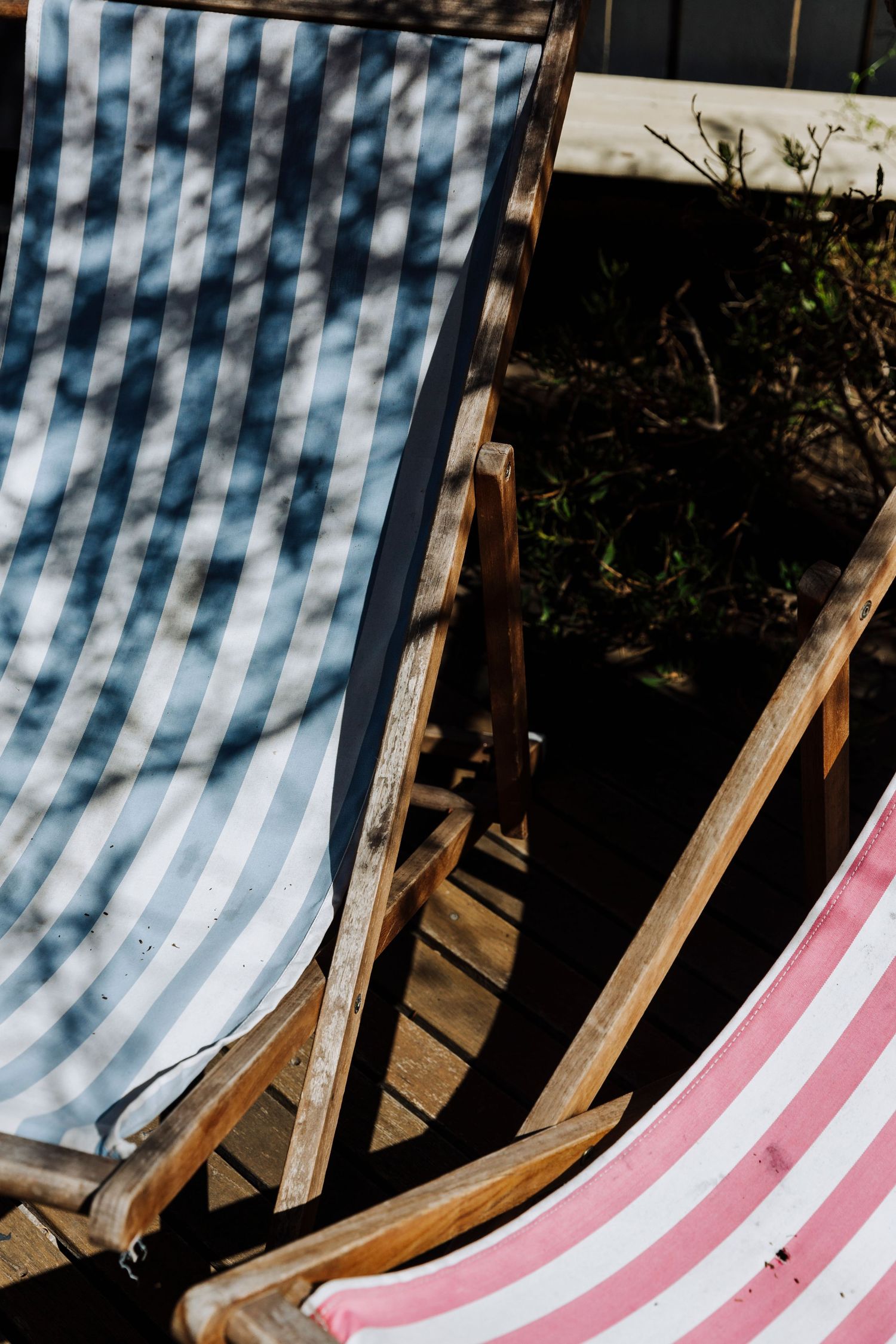 Close up of outdoor seats in the garden at My Sister and The Sea, Marion Bay, South Australia