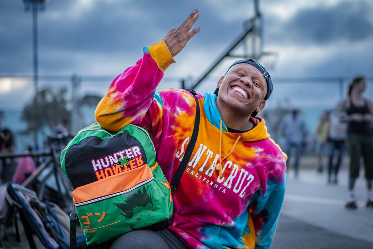 Professional headshot photograph of a man wearing a colorful outfit at Panther Skate Plaza in California.