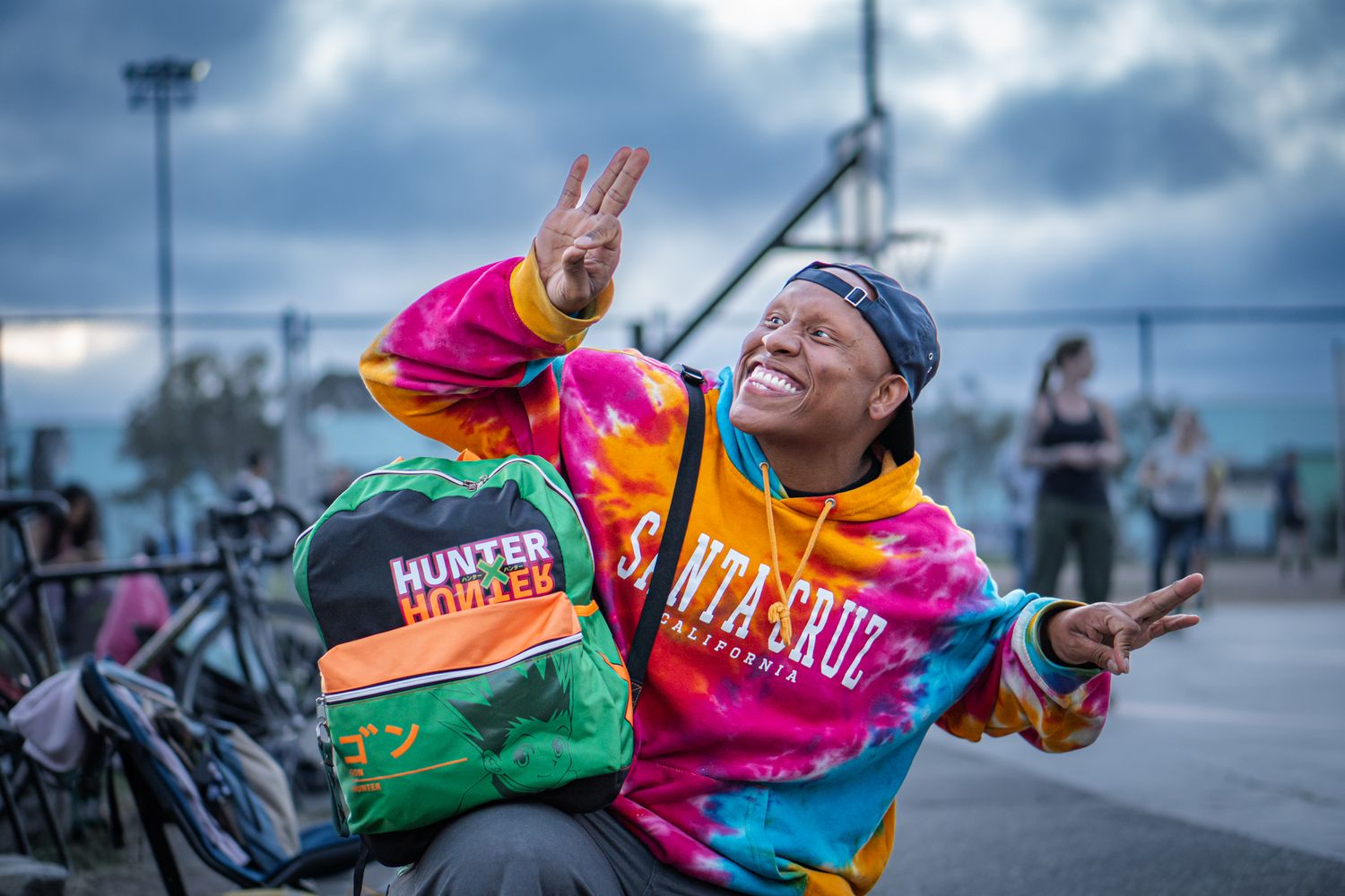 Professional headshot photograph of a man wearing a colorful outfit at Panther Skate Plaza in California.