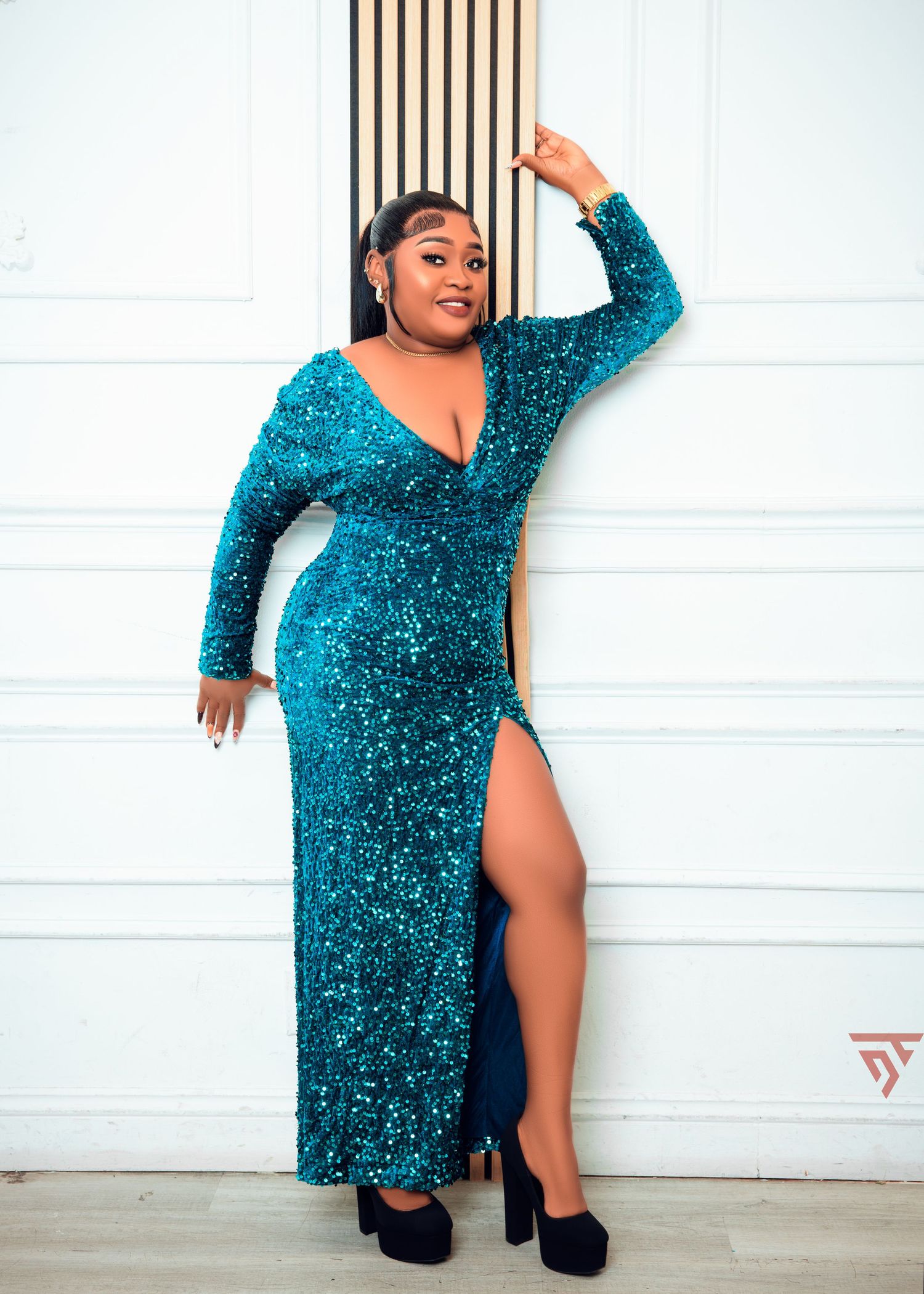 Glamorous teal sequined dress photoshoot featuring dramatic poses against white backdrop.