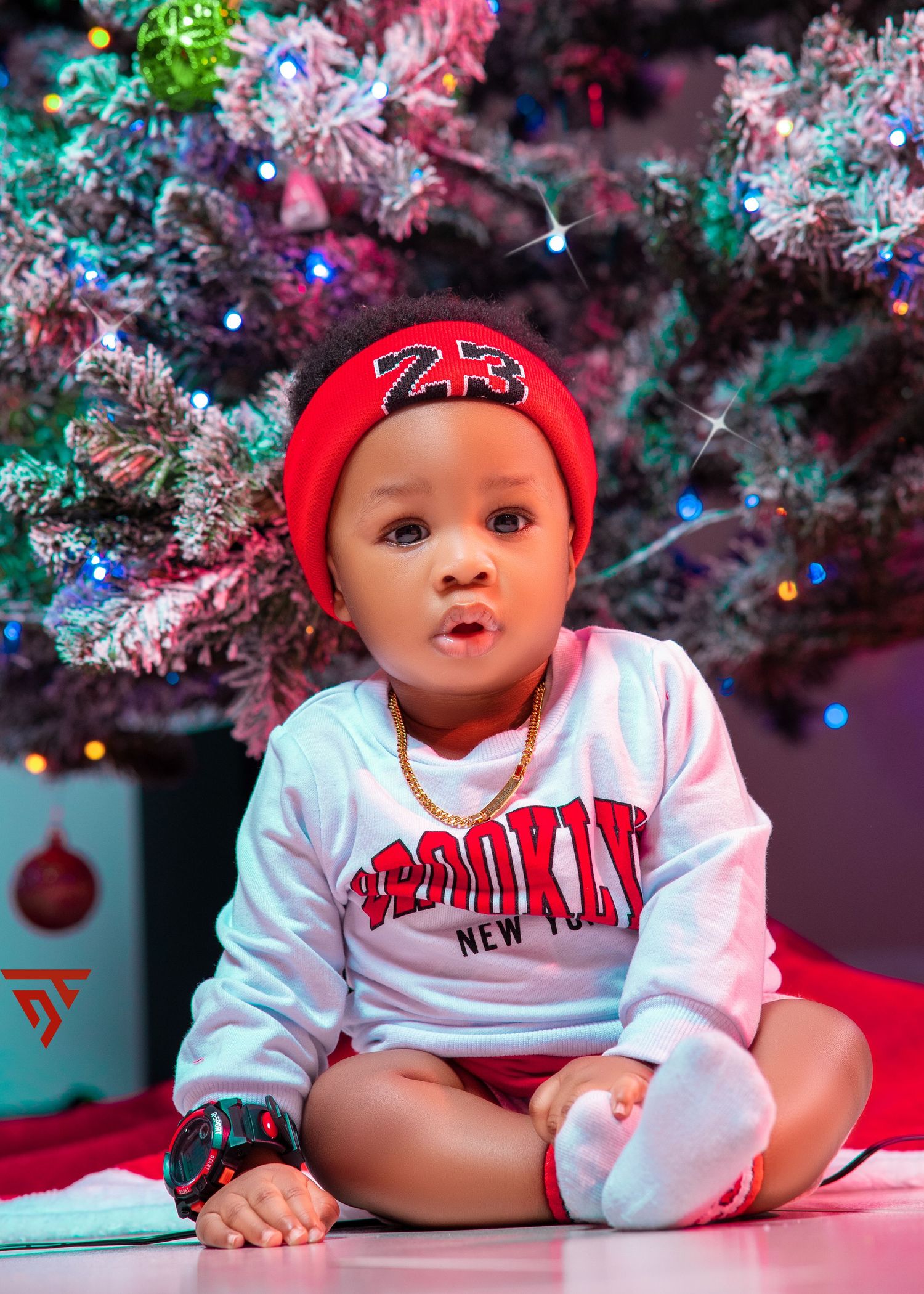 Holiday themed photo featuring white and red sportswear against a decorated Christmas background.