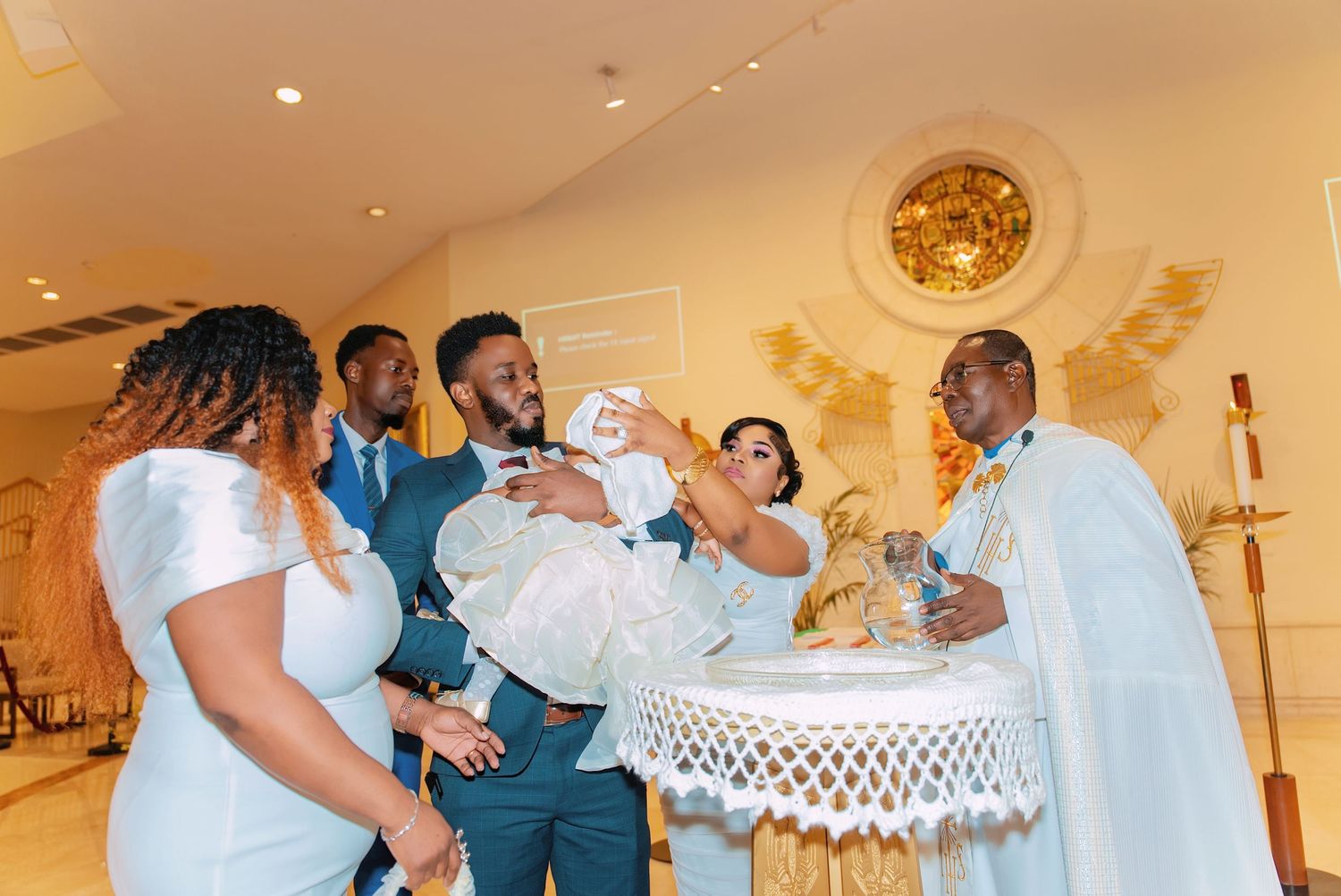 Wedding guests celebrating and dancing together in an elegant church hall.