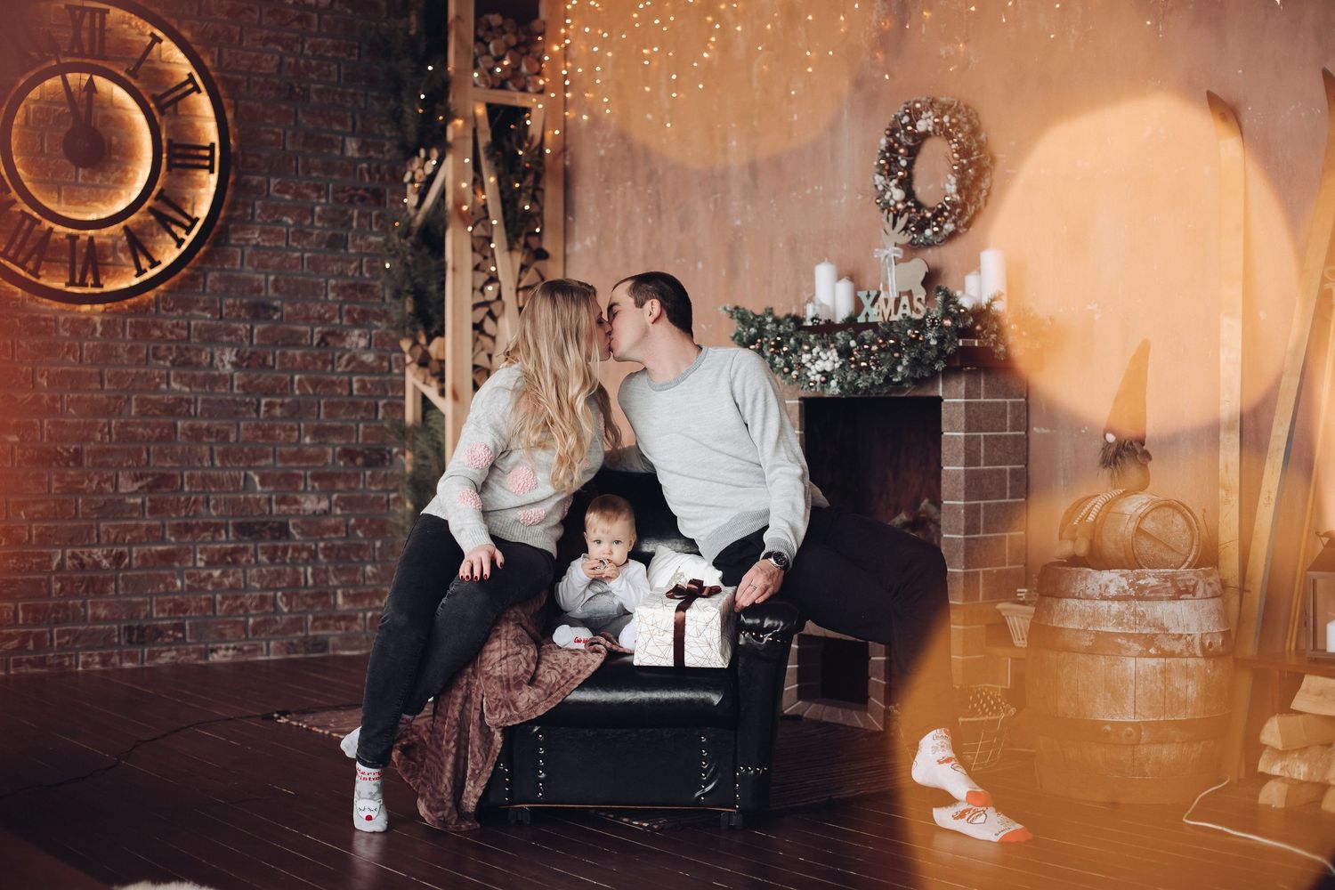 Warm-toned photography in a brick-walled room with vintage decor and bokeh lighting effects.