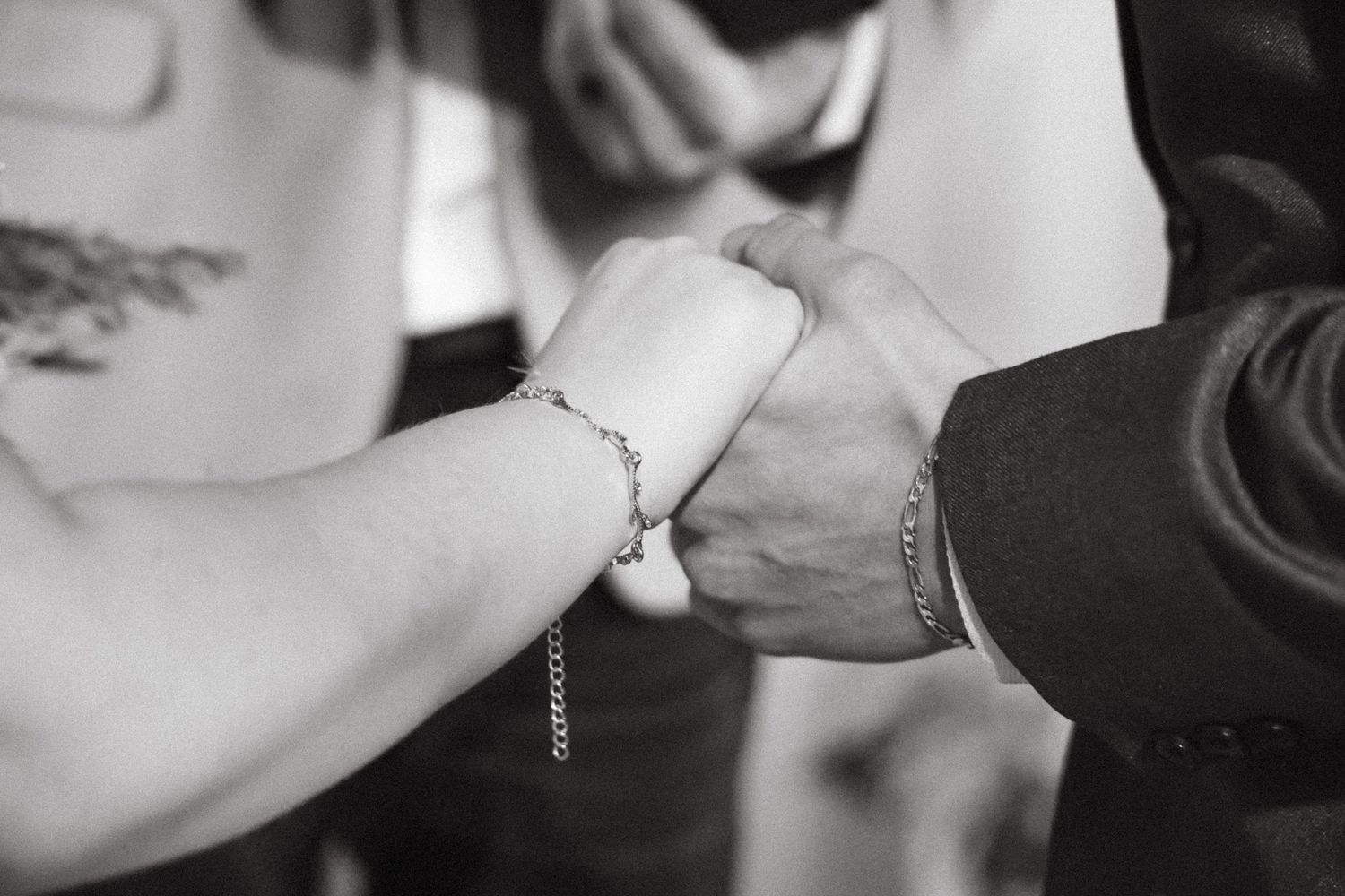 Close-up black and white photo capturing tender moments between a couple.