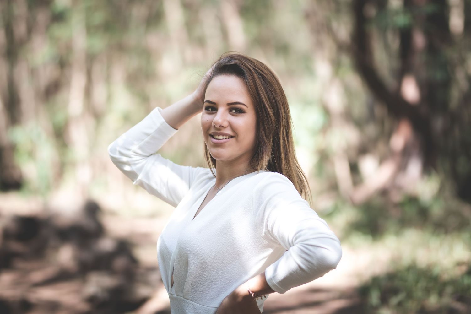 Outdoor portrait session showcasing natural expressions in wooded setting.