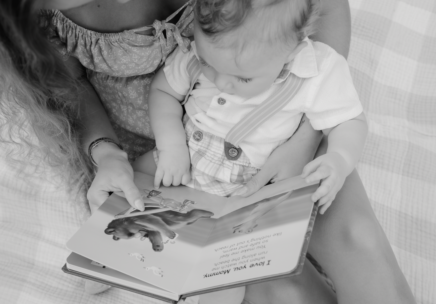 A series of black and white photos showing hands holding books and reading in various positions.
