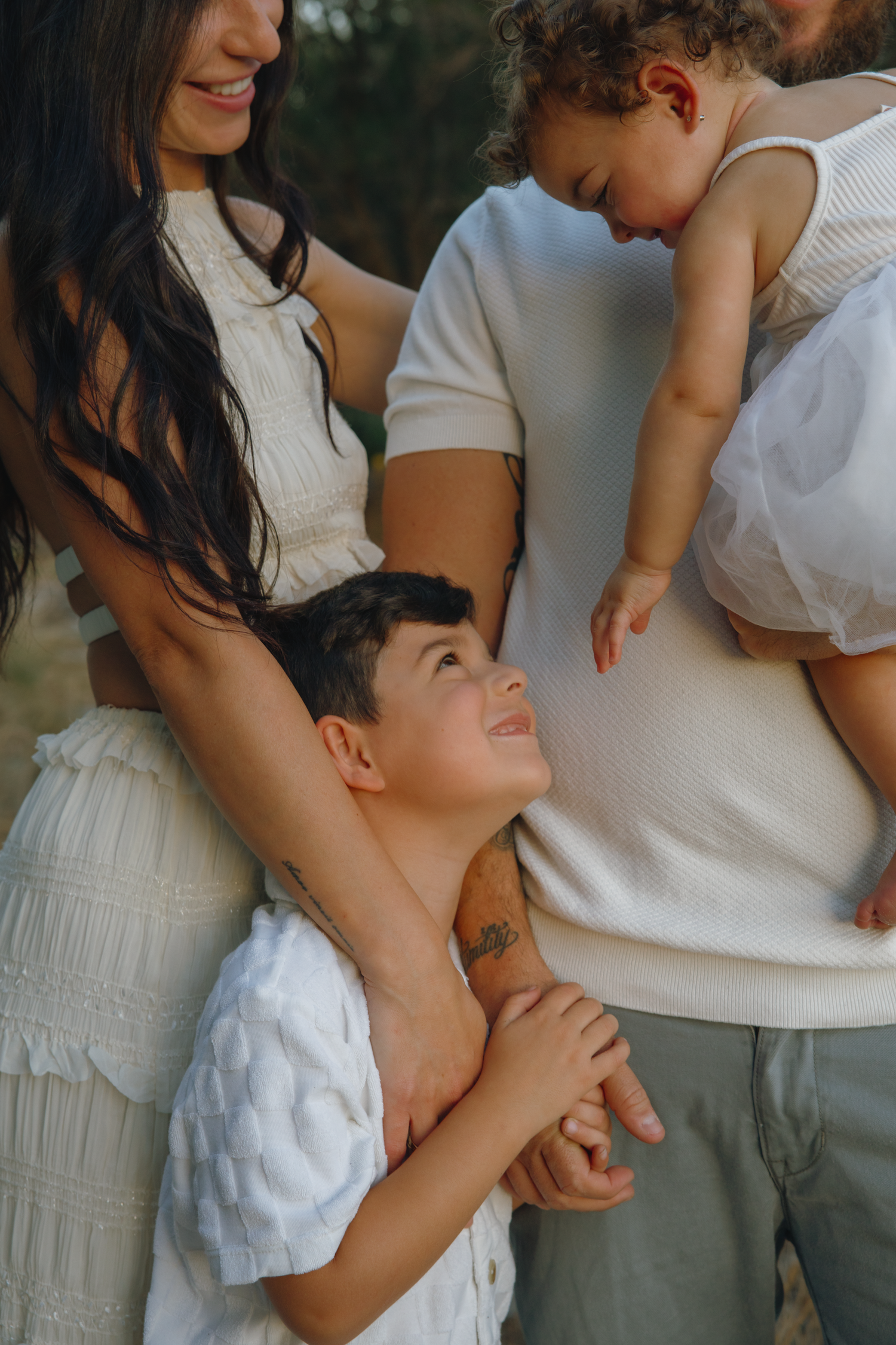 A series of intimate family photos showing tender moments between parent and child in soft, natural lighting.
