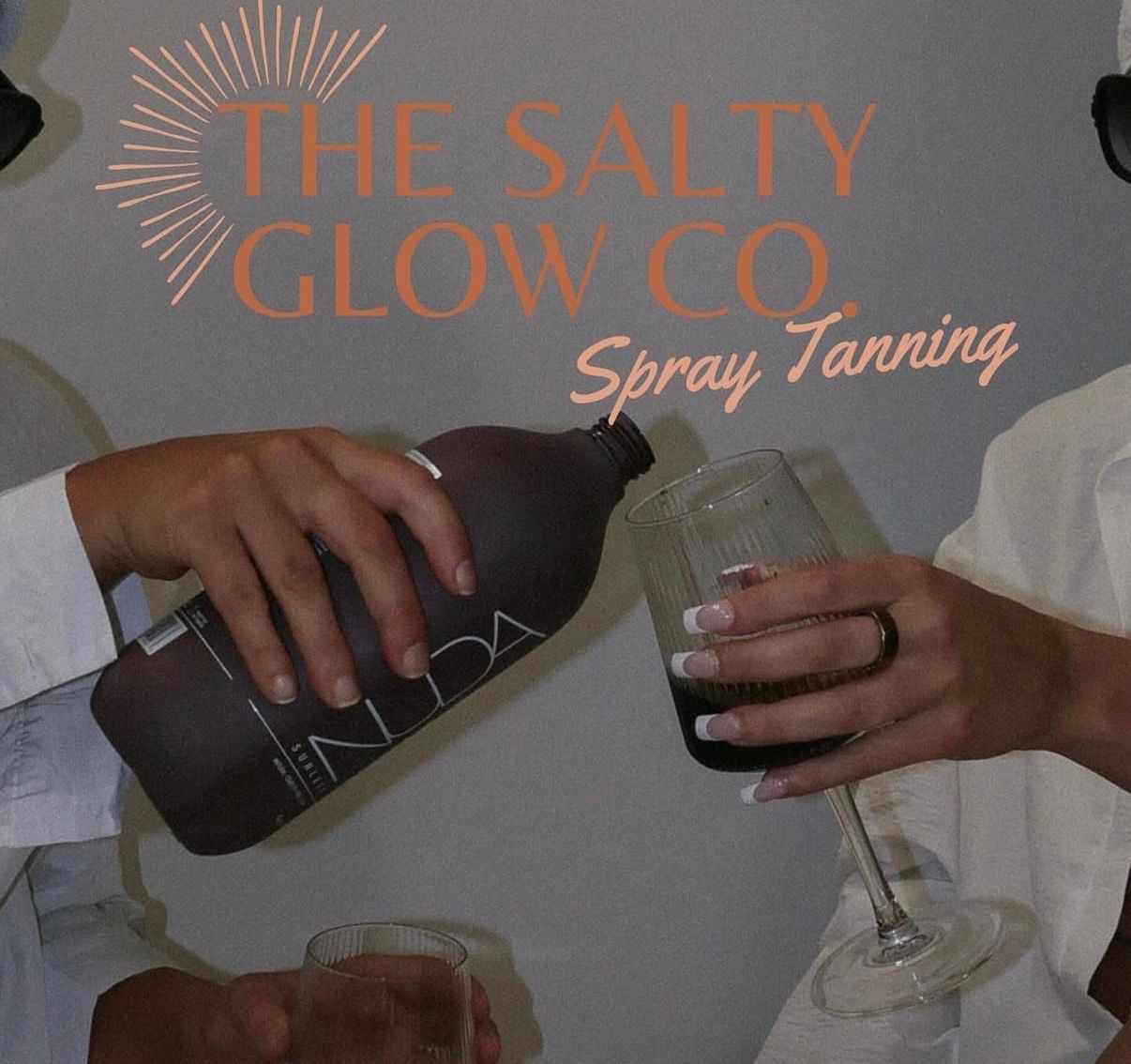 The Salty Glow Co. spray tanning logo with two people clinking a dark bottle and wine glass together.