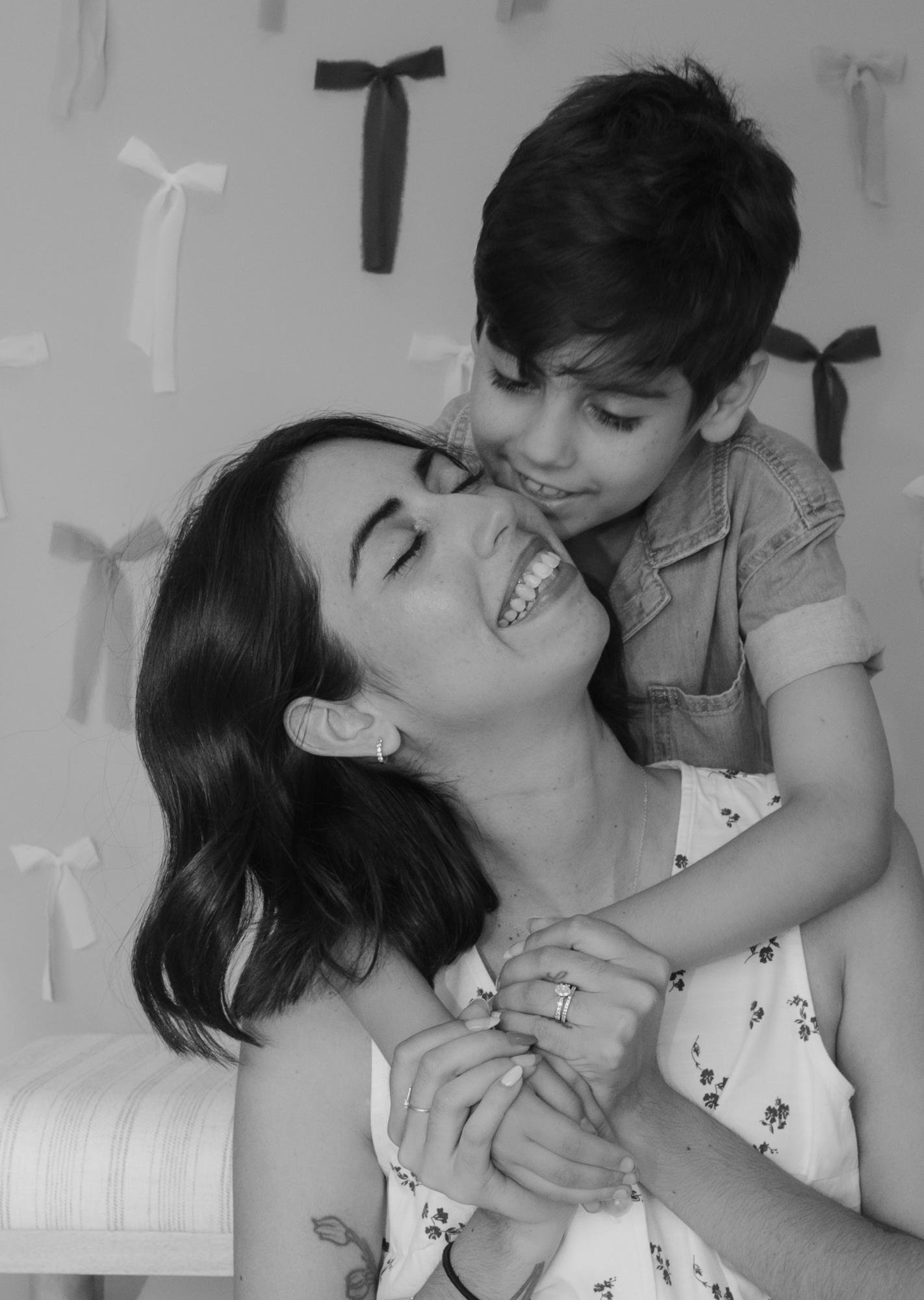 A tender black and white photo sequence showing a parent and child sharing affectionate moments together.
