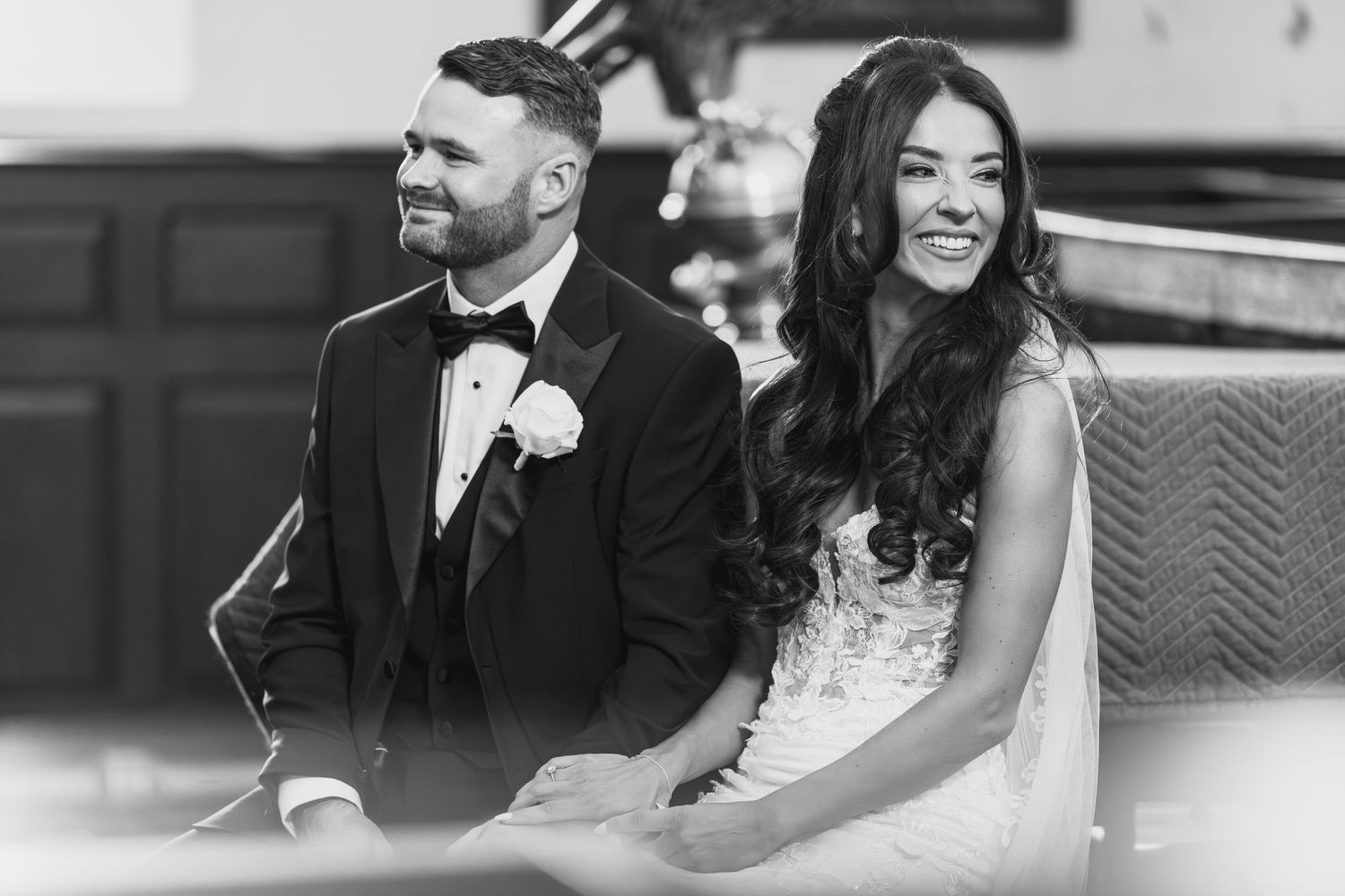 Candid black and white photo collage of a wedding couple sharing joyful moments together throughout their special day.