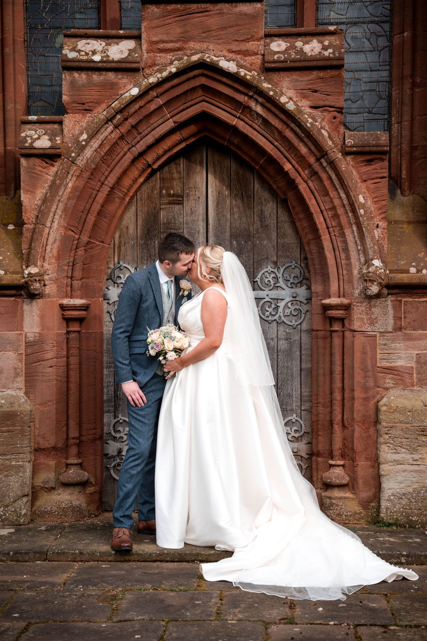 Wedding photos taken in front of ornate stone church archways with gothic architecture details.
Stockton house wedding venue