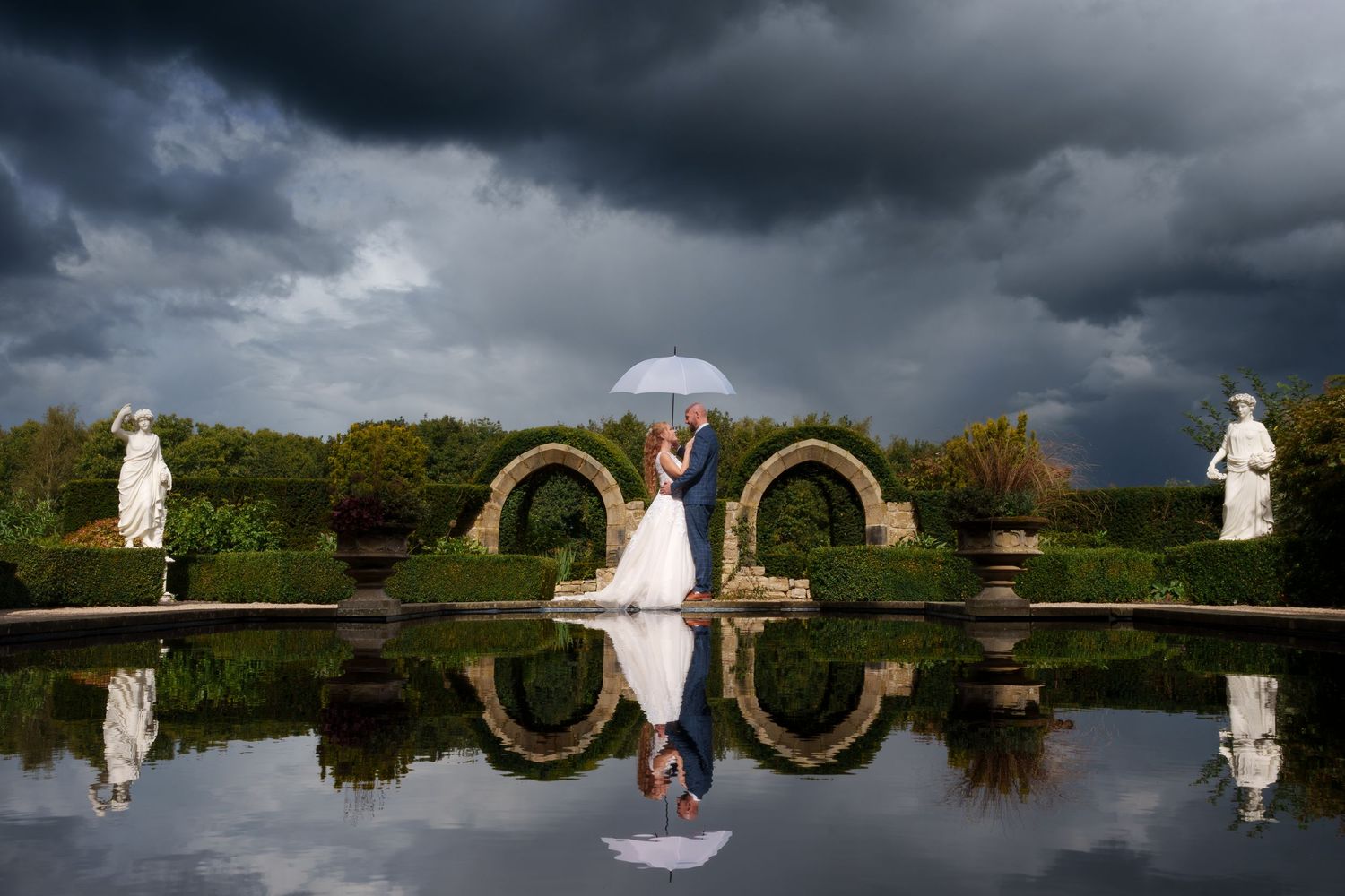 A collection of dramatic wedding photos showing silhouettes against stormy skies with reflections in water.