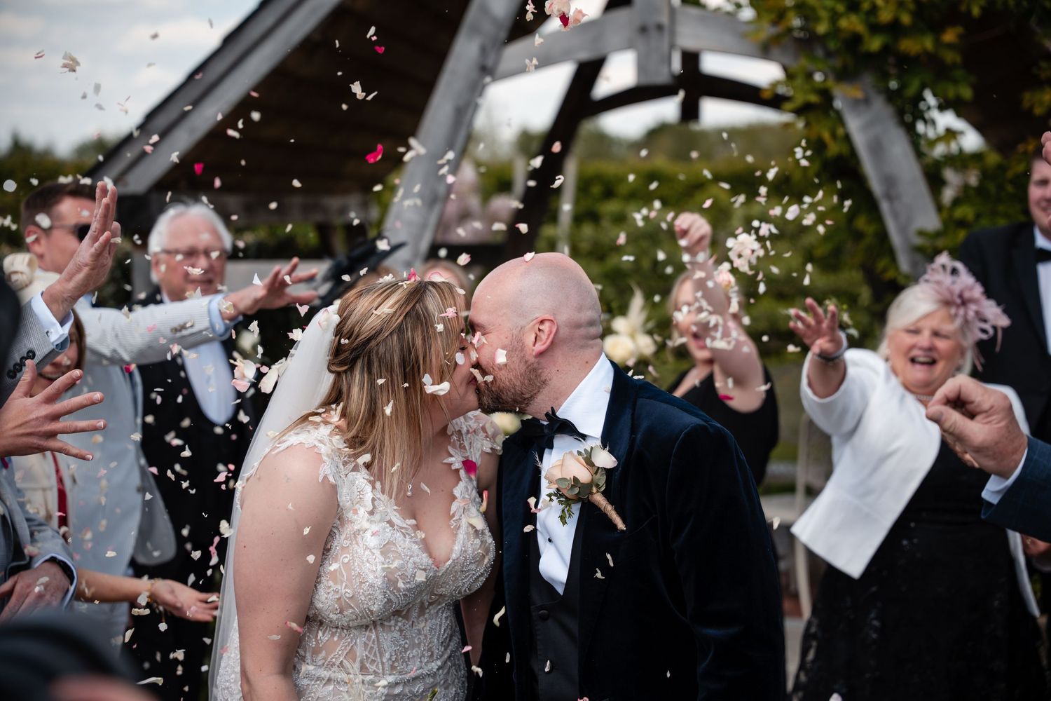 Joyful wedding celebration with confetti toss under garden pergola.
Cider mill barns wedding venue