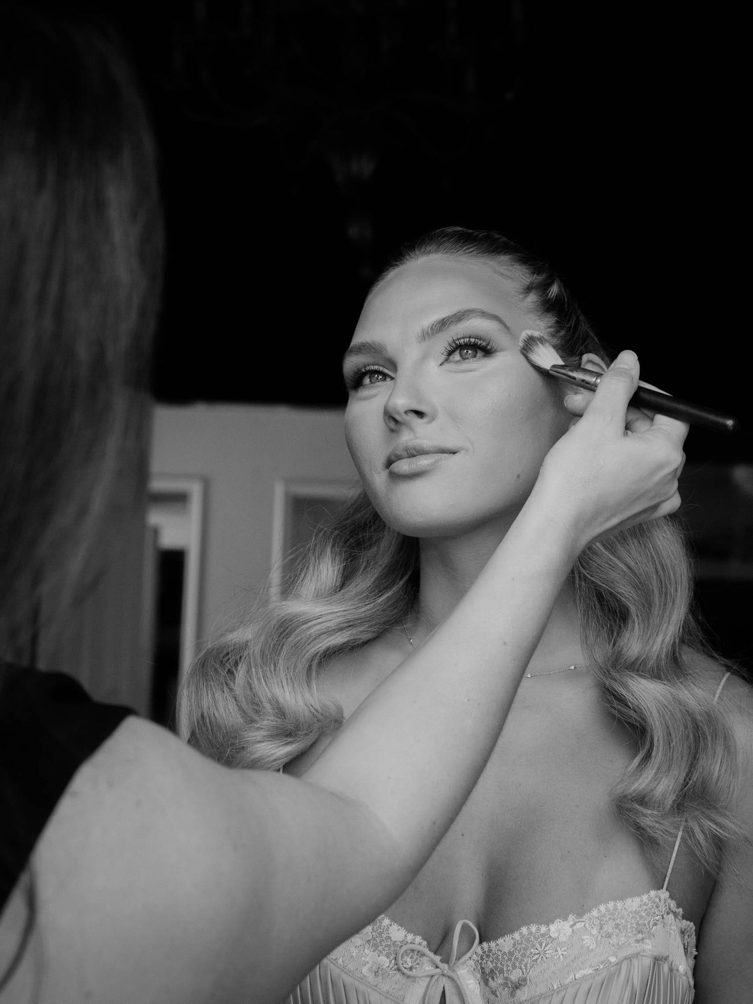 Black and white glamour portrait series showing elegant styling with dramatic lighting and vintage-inspired hair.