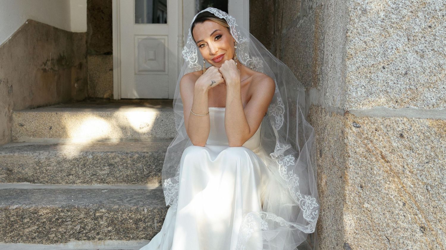A series of elegant wedding portraits captured against a classic stone architecture backdrop with natural lighting.