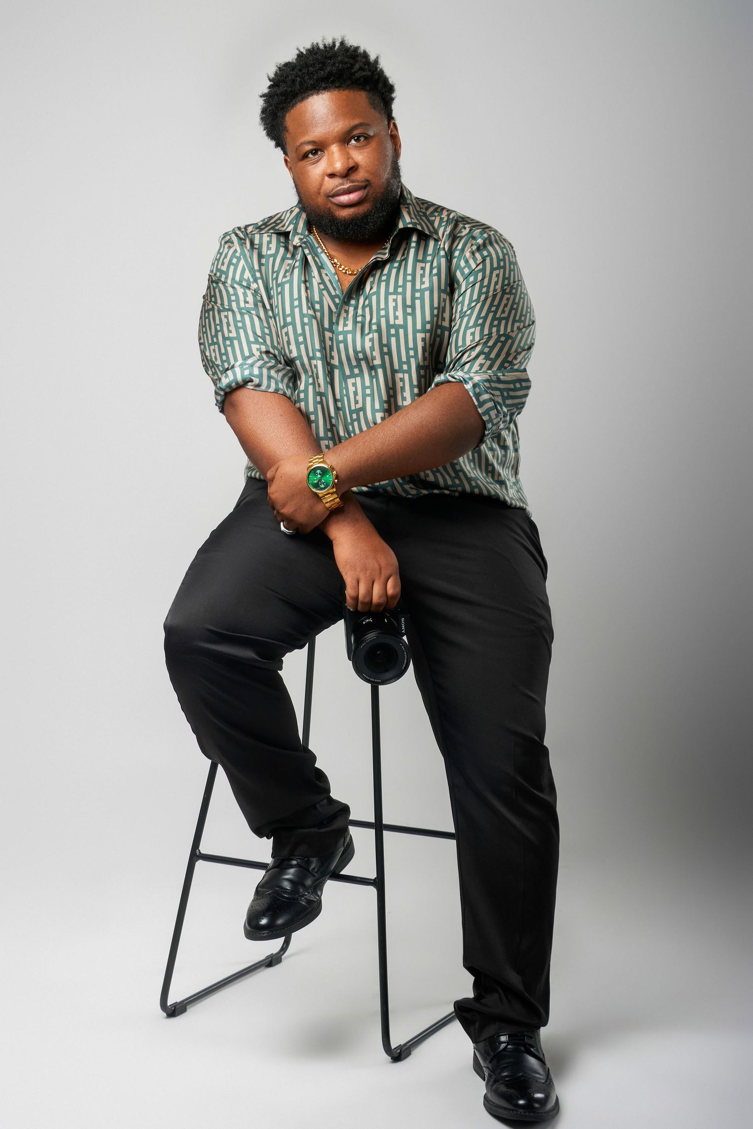 Professional studio portrait session showing various seated poses against a light gray backdrop. Powerrpackmedia Houston Texas