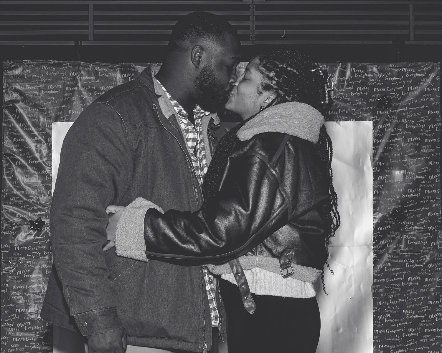 Black and white candid photographs showing intimate moments against a brick wall background. Powerrpackmedia Houston Texas