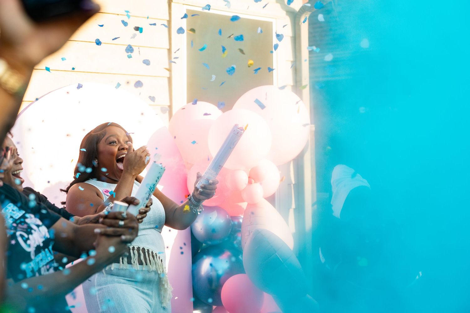 Colorful powder explosion in shades of blue and pink creates a vibrant celebratory atmosphere. Powerrpackmedia Houston Texas