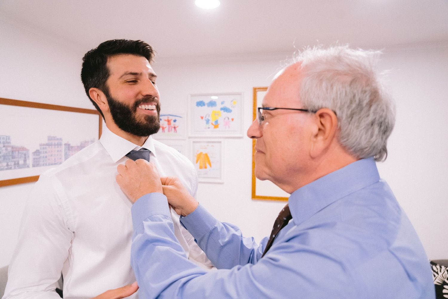 Two colleagues having a friendly interaction in a bright office space.
