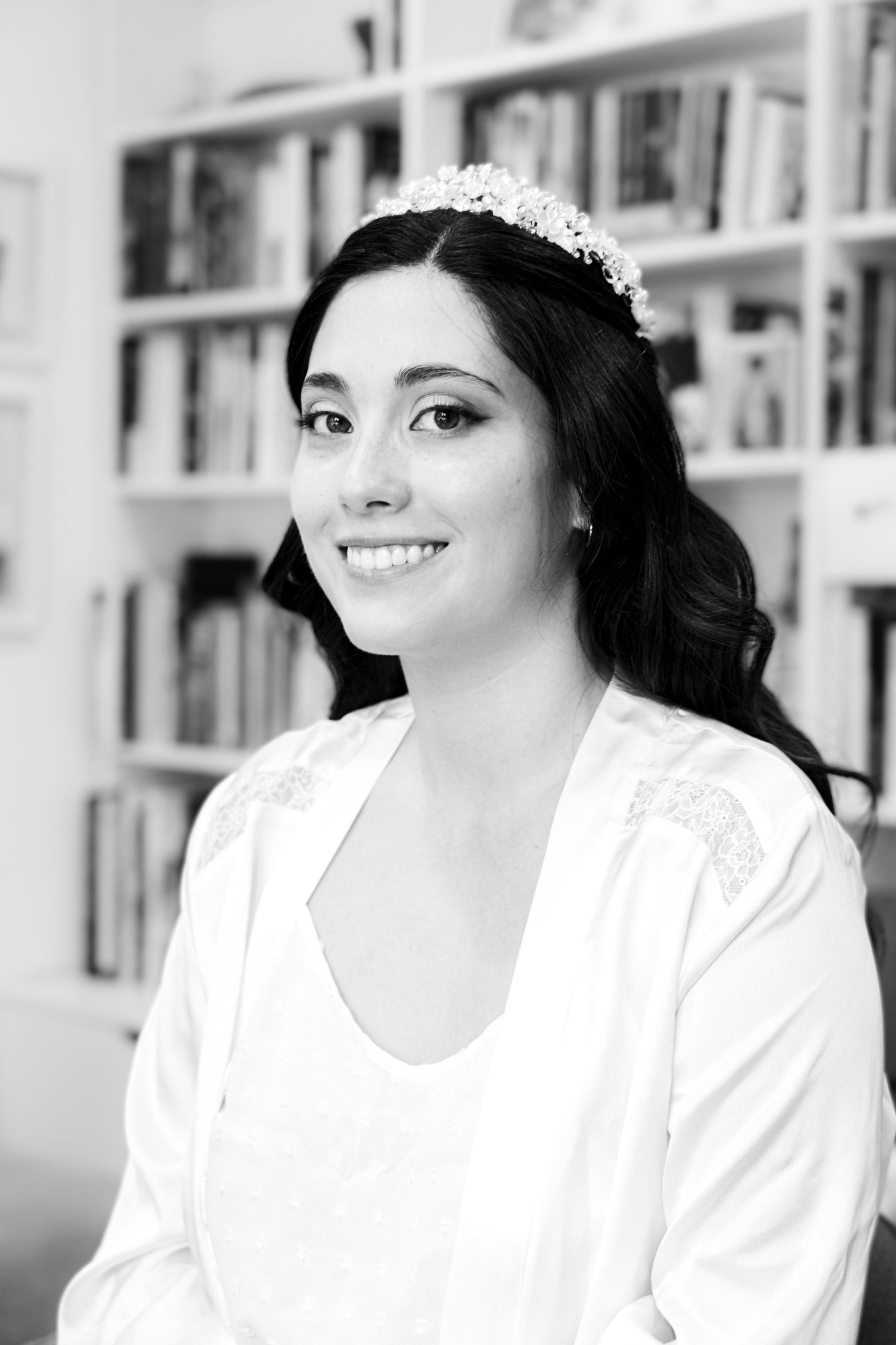 Black and white portraits showing bridal preparation moments against a white bookshelf.