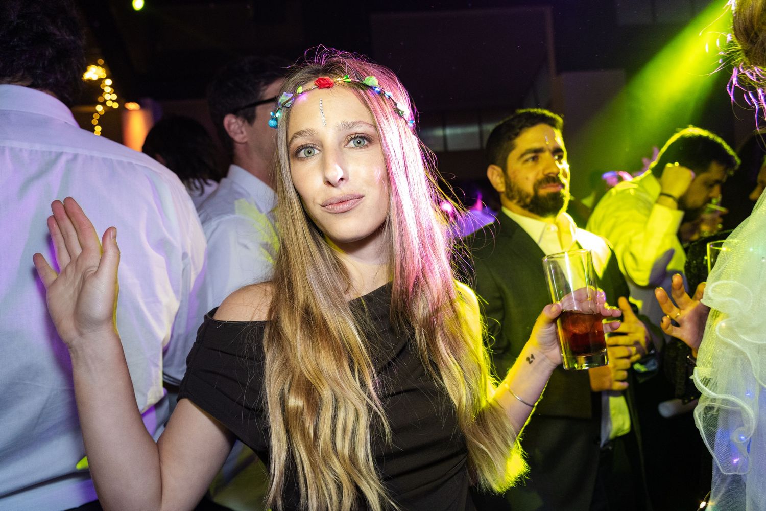 Dance party celebration with neon lighting and festive atmosphere.