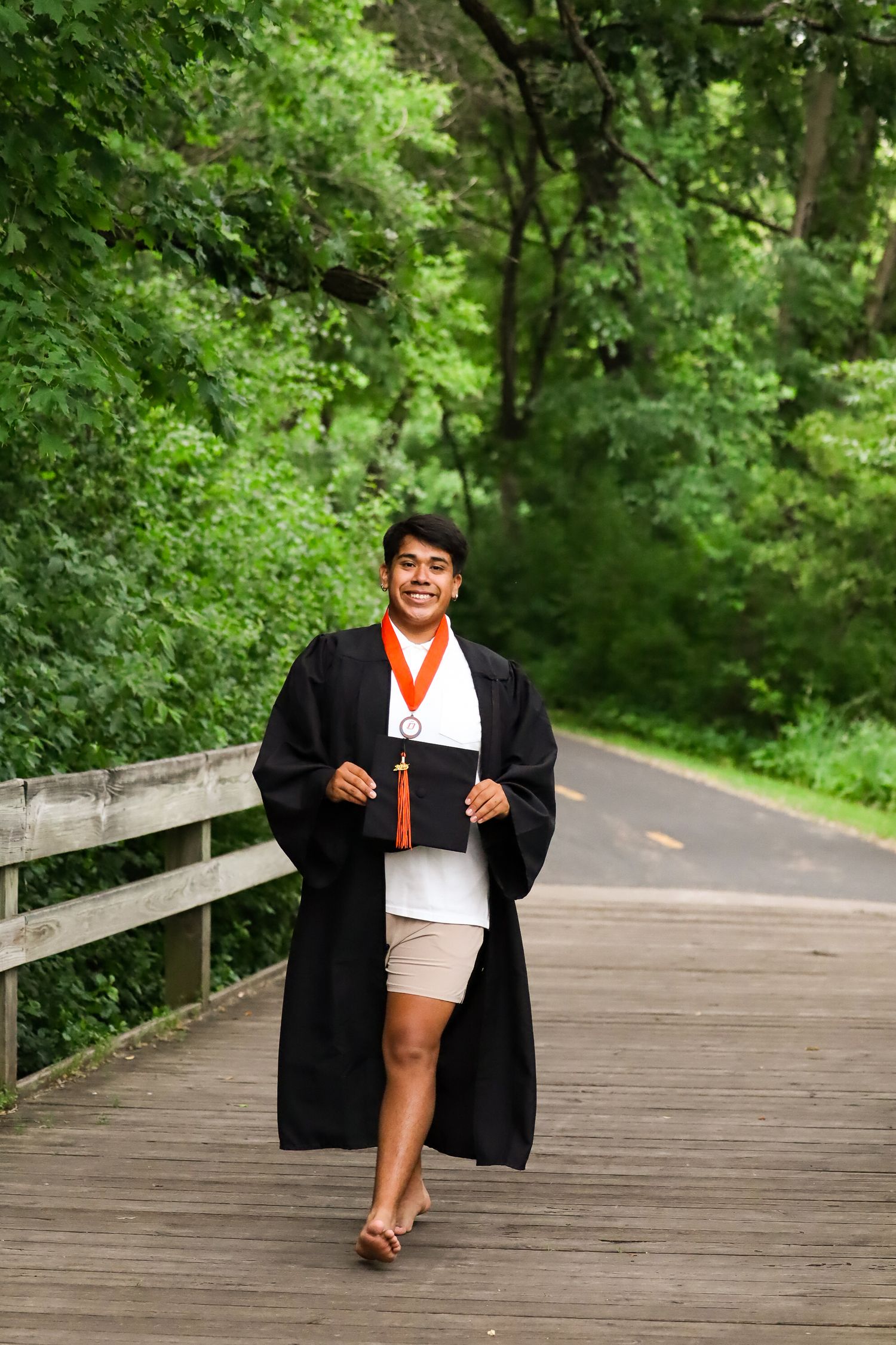High school graduation portrait. Garden, park.