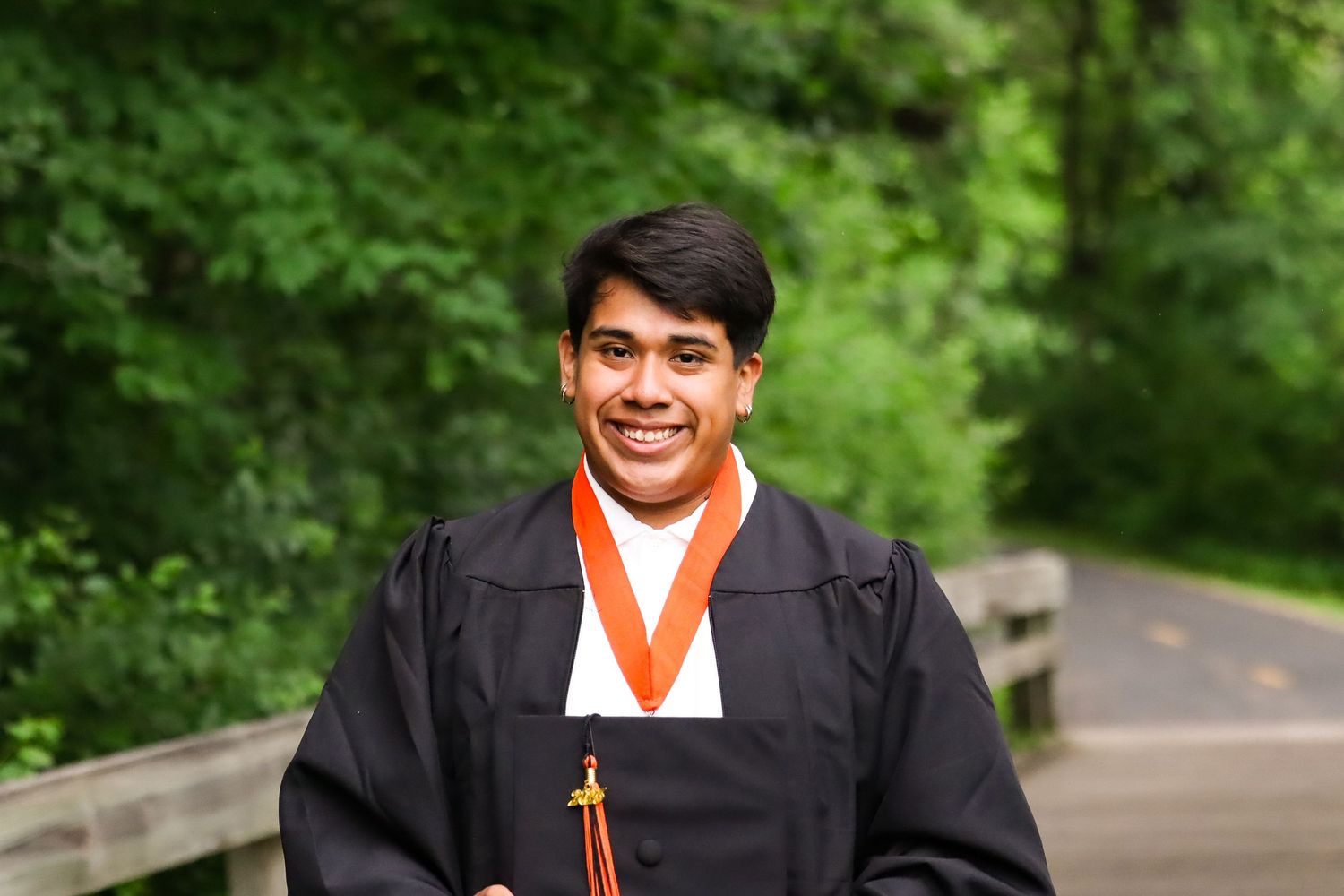 High school graduation portrait. Garden, park.