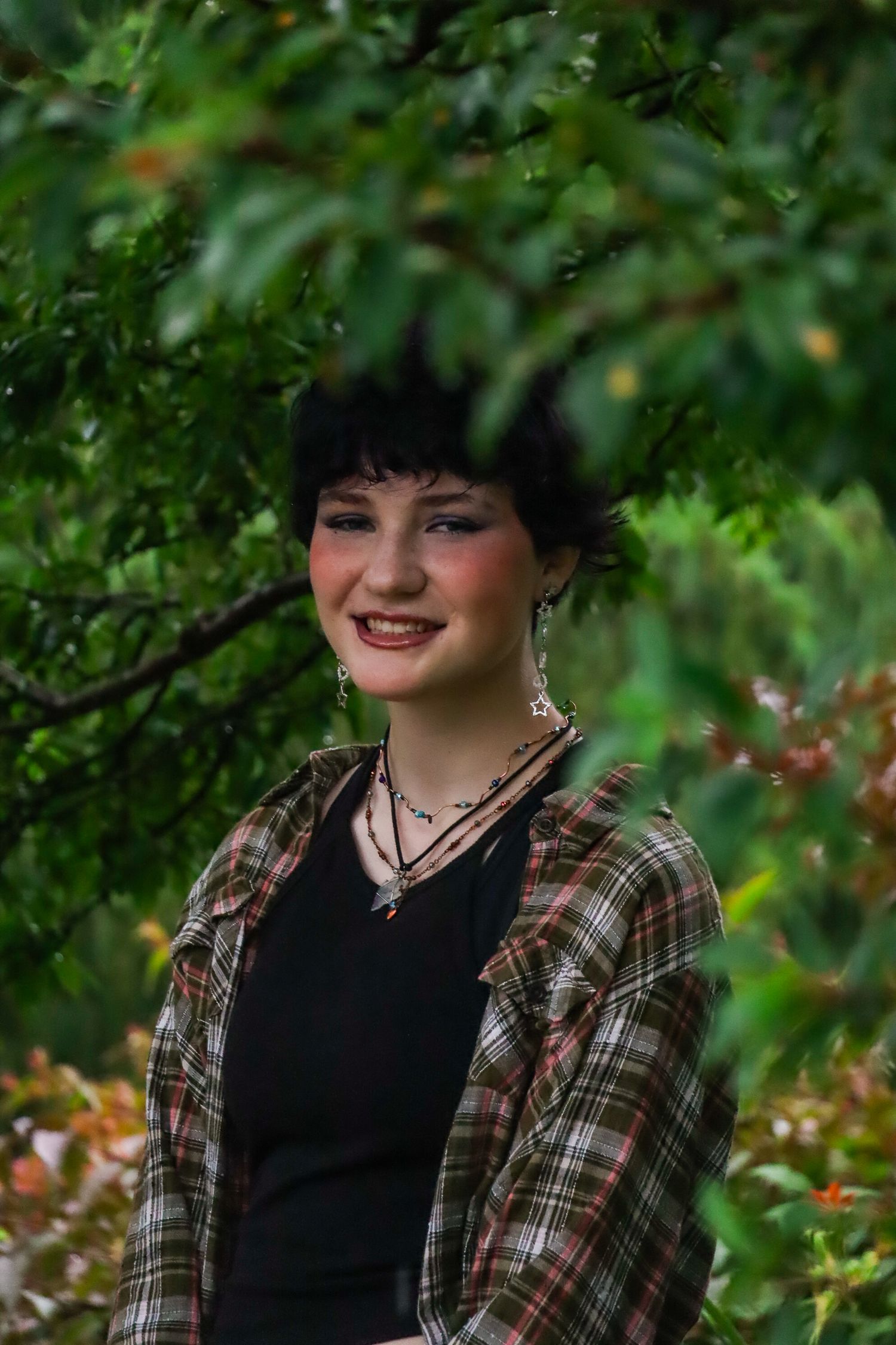 Senior portrait. Rainy, garden.