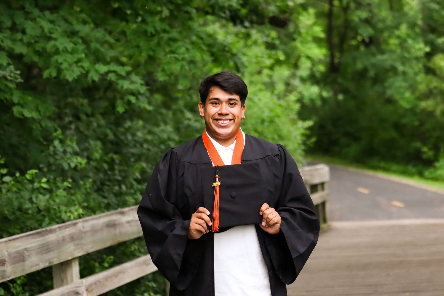High school graduation portrait. Garden, park.