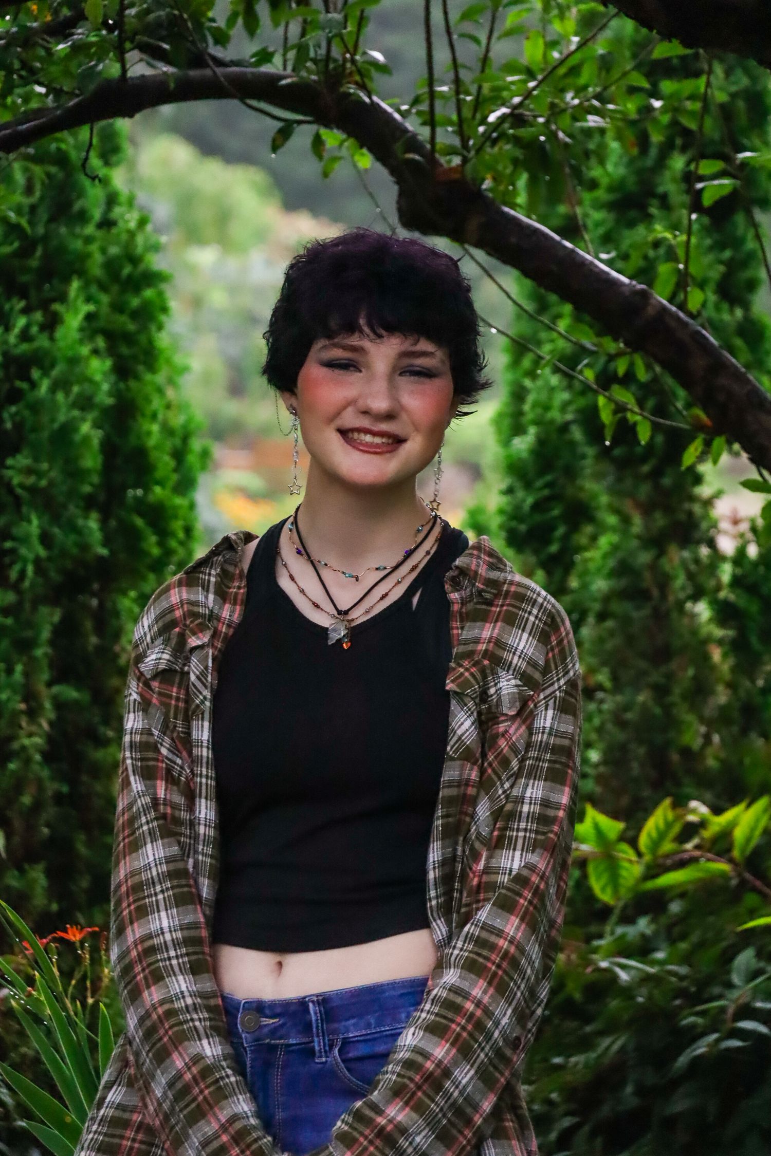 Senior portrait. Rainy, garden.